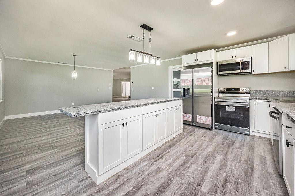 Fully renovated and move-in ready, this spacious 2,268 sqft home offers exceptional value in Port St. Lucie. Featuring a brand-new roof, impact windows and doors, new A/C system, updated bathrooms, and a flexible oversized layout ideal for families, remote work, or entertaining. Unlike many older homes in the area, the major systems have already been replaced, helping reduce future maintenance and insurance concerns. Conveniently located near shopping, schools, parks, and major highways.