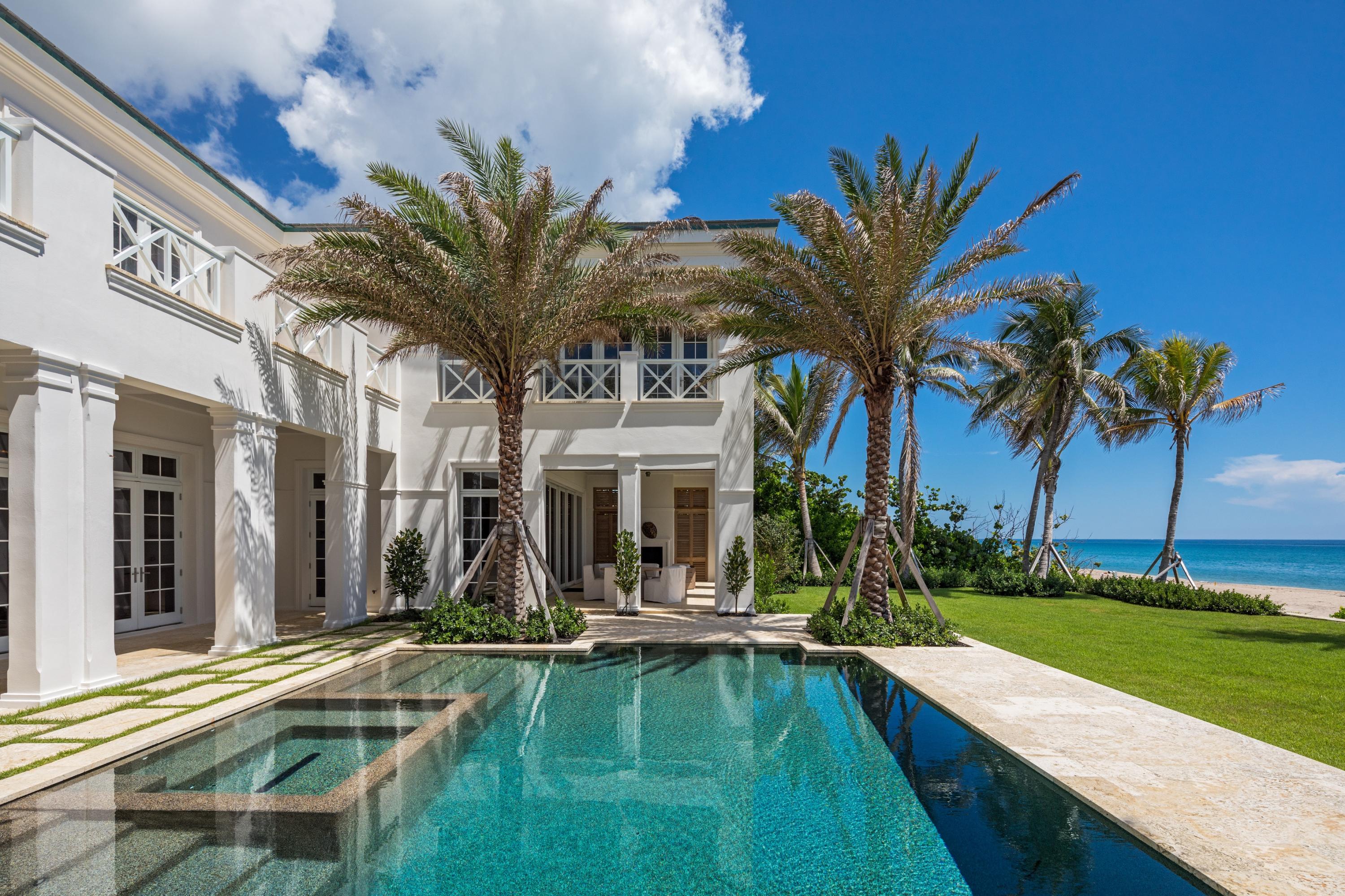 Completely Rebuilt in 2017... Begin each day with the sun rising over the horizon on the most spectacular stretch of beach located at 3501 N Ocean Blvd. in Gulf Stream. This classic yet chic new oceanfront estate is set high above the dune in sublime privacy offering expansive ocean views from nearly every room. Tucked behind privacy gates, an amenity rich lifestyle evocative of perfection awaits the most discerning.  Sophisticated design by Rustem Kupi architects blends the most luxurious finishes and modern conveniences with the latest codes and standards of today. A flexible floor plan revealing 7,486 TSF, five bedrooms, and 5.2 Baths constitute the finest in architectural finishes with an open layout creating airy, sun-drenched interiors. Light and space flow into a fabulous great room with soaring ceiling fireplace and Exotic wood surround a modular arts wall, wide plank European white oak floors, white limestone floors, and french doors lead to indoor/outdoor entertaining. Light splashes through the ocean facing master with balcony that is designed with a wood paneled bed wall, electric black out shades, and morotrized bed mounted TV lift. The luxurious his/her master bath with heated bathroom floors yield  a sense of Zen within it's doors.  Three additional en-suite bedrooms and a media lounge encompass the second floor.  Located on the ground floor is a guest or in-law suite. The epicurean master chef's kitchen feasts on the magnificent blue ocean views and features white custom lacquered and wood grain cabinetry as well as stainless steel glass cabinetry, white quartz countertops with waterfall edges, top performing luxury appliances and a full butler's pantry.  In addition, the estate offers a formal dining room complete with a custom paneled China room with electrified glass for privacy. Adjacent to the kitchen is an inviting gathering area with floor to ceiling glass doors leading to a loggia that is complete with fireplace, built in electric shades to seamlessly integrate the interior and exterior spaces. Outdoor living is punctuated by lush tropical landscaping, a large level garden/yard and a salt-water pool and spa. At 3501 N Ocean Blvd. in Gulf Stream, guests and family enjoy a private beach second to none and yet easy access to a fine medley of dining, boutique shopping, and cultural events.