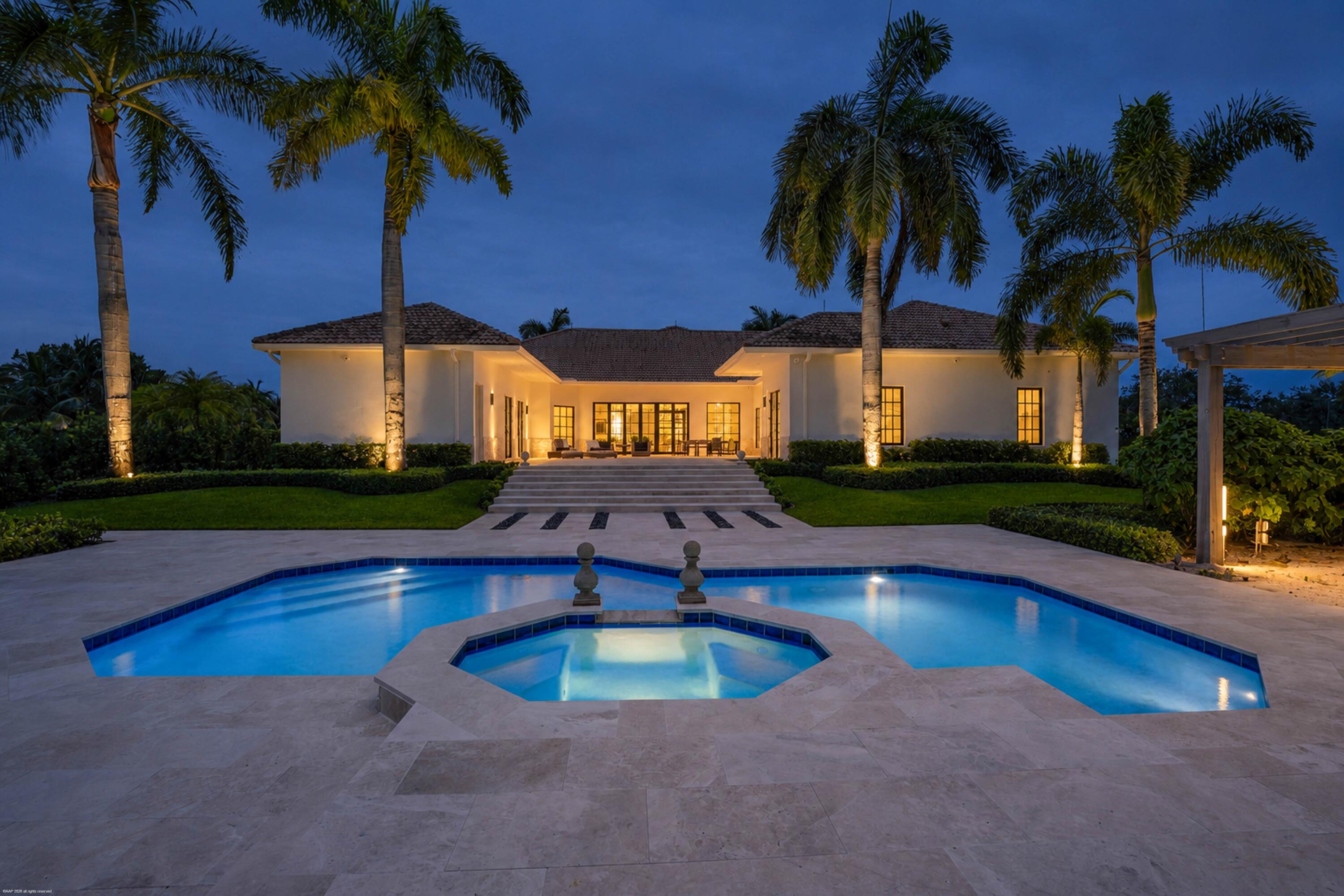 A must see exceptional 5.73-acre equestrian estate in the prestigious gated community of Palm Beach Point, where luxury living meets world-class equestrian amenities! Meticulously landscaped and thoughtfully designed, this property offers the perfect balance of elegance, comfort, and equestrian functionality with a stunning 14-stall stable. The beautifully renovated 3-bedroom, 4.5-bath residence features an open-concept floor plan with abundant natural light, an office and den, designer finishes, and premium appliances. Designed to accommodate the needs of the discerning equestrian, the 2017 CBS center-aisle barn features 14 stalls, 7 paddocks, a generous 265' x 150' riding arena with new footing, and 2 staff apartments, totaling 3-bedrooms. See "Supplement Remarks" for more details. Hurricane-impact windows and doors, a whole-house generator, and a reverse osmosis water filtration system provide comfort, security, and peace of mind. Recent 2026 improvements include fresh interior and exterior paint, a newly refinished pool, all-new patio and pool decking, custom window treatments throughout and the addition of a second generator and propane tank to support the barn & apartments. The equestrian amenities have also been enhanced with new arena footing and irrigation, completed in December 2025. Whether entertaining or enjoying a quiet evening at home, the residence offers an inviting atmosphere with exceptional craftsmanship and attention to detail. The fully fenced and gated estate is enveloped by mature tropical landscaping, creating a private sanctuary just minutes from Wellington International and Wellington's world-renowned equestrian venues, offering the ultimate luxury equestrian lifestyle.