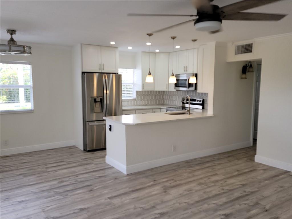 REDUCED FOR QUICK SALE. THIS UNIT HAS IT ALL.COMPLETELY RENOVATED FROM THE STUDS OUT.NEW ELECRICAL SYSTEM,HARD WOODCABINETS BEAUTIFUL QUARTZ COUNTERTOPS AND HIGH END APPLIANCES, MAKE THIS UNIT GREAT FOR ENTERTAINING. JUST STEPS FROM HOUSE OF WORSHIP AND PUBLIX. THIS UNIT HAS IT ALL.BEATIFULLY AND TASTEFULLY REDONE BATHROOMS. TRUE MASTER WITH ENSUITE. GREAT VIEWS FROM THE ENCLOSED LANAI/FLORIDA ROOM.  THIS ONE WONT LAST