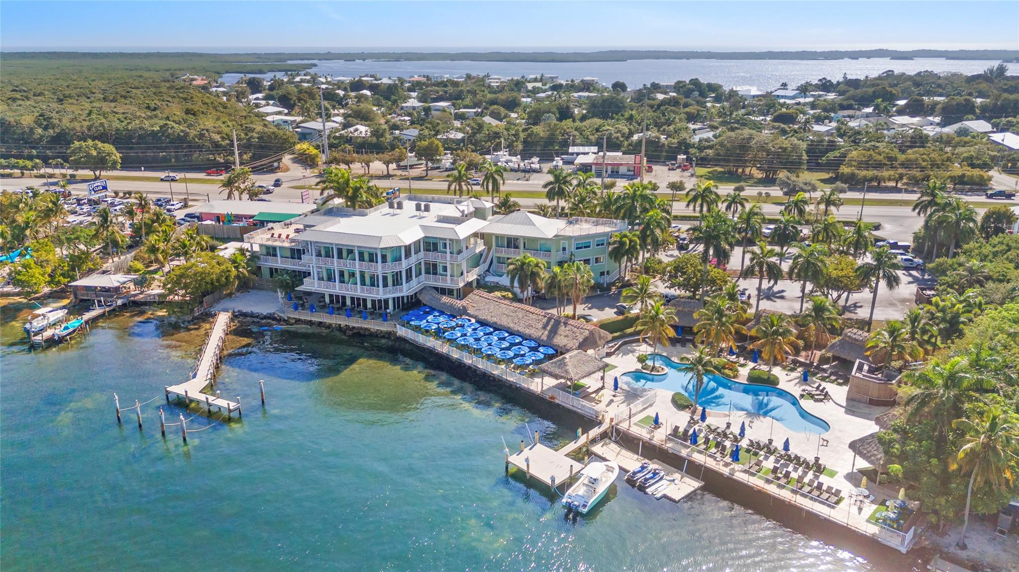 Vacation Home Fractional Ownership in a luxury setting in Key Largo, FL! Welcome to the Residence Club at Fisherman's Cove! Enjoy any of the 6 fully furnished designer-decorated 3 bedroom/3 bathroom, 2,300 +/- square foot residences throughout the year on a weekly basis. Large 450 sq ft balconies wrap each unit, allowing you to enjoy views of Blackwater Sound and the resort-style pool. Owners can play at the pool, relax in tiki style cabanas or enjoy privacy on the owner's deck while watching the famous Florida Keys sunsets. Each unit equipped with Smart TVs and WIFI. Kitchens are fully stocked. 2 boats available for use - 26' Sea Fox and 24' Contender. Most owners use the residences 5-7 weeks per year. Our property includes 6 private residences sitting above Jimmy Johnson's Big Chill.