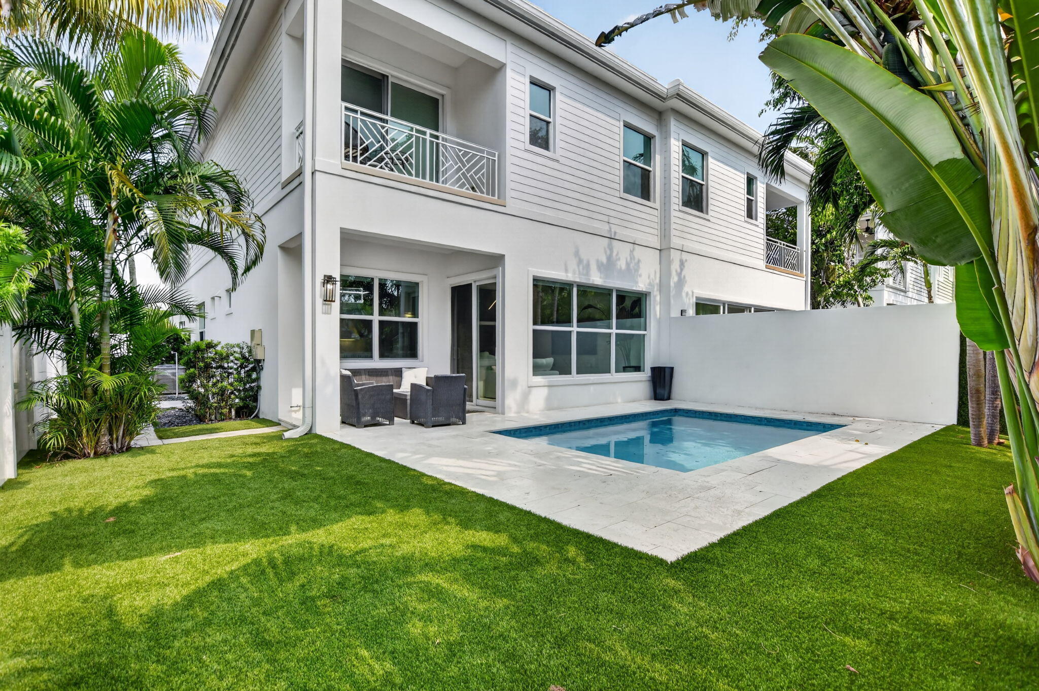 Coastal luxury meets modern sophistication in this exceptional Boca Riviera residence just steps from the Ocean and Intracoastal Waterway. Built in 2020, this 3BR/3.5BA + office/den home features soaring ceilings, impact glass throughout, and refined finishes. The open-concept layout showcases a chef's kitchen with quartz countertops, natural gas cooking, and seamless flow to the main living areas—ideal for elevated entertaining and everyday coastal living. Designed for true indoor-outdoor living, the home opens to a private resort-style backyard with a saltwater pool, lush tropical landscaping, and turf for low-maintenance privacy. The Master suite offers a serene retreat with a private balcony overlooking the pool. Ideally located minutes from Downtown Boca, Mizner Park Furnished or Unfurnished. Submit offers to listing agent.
