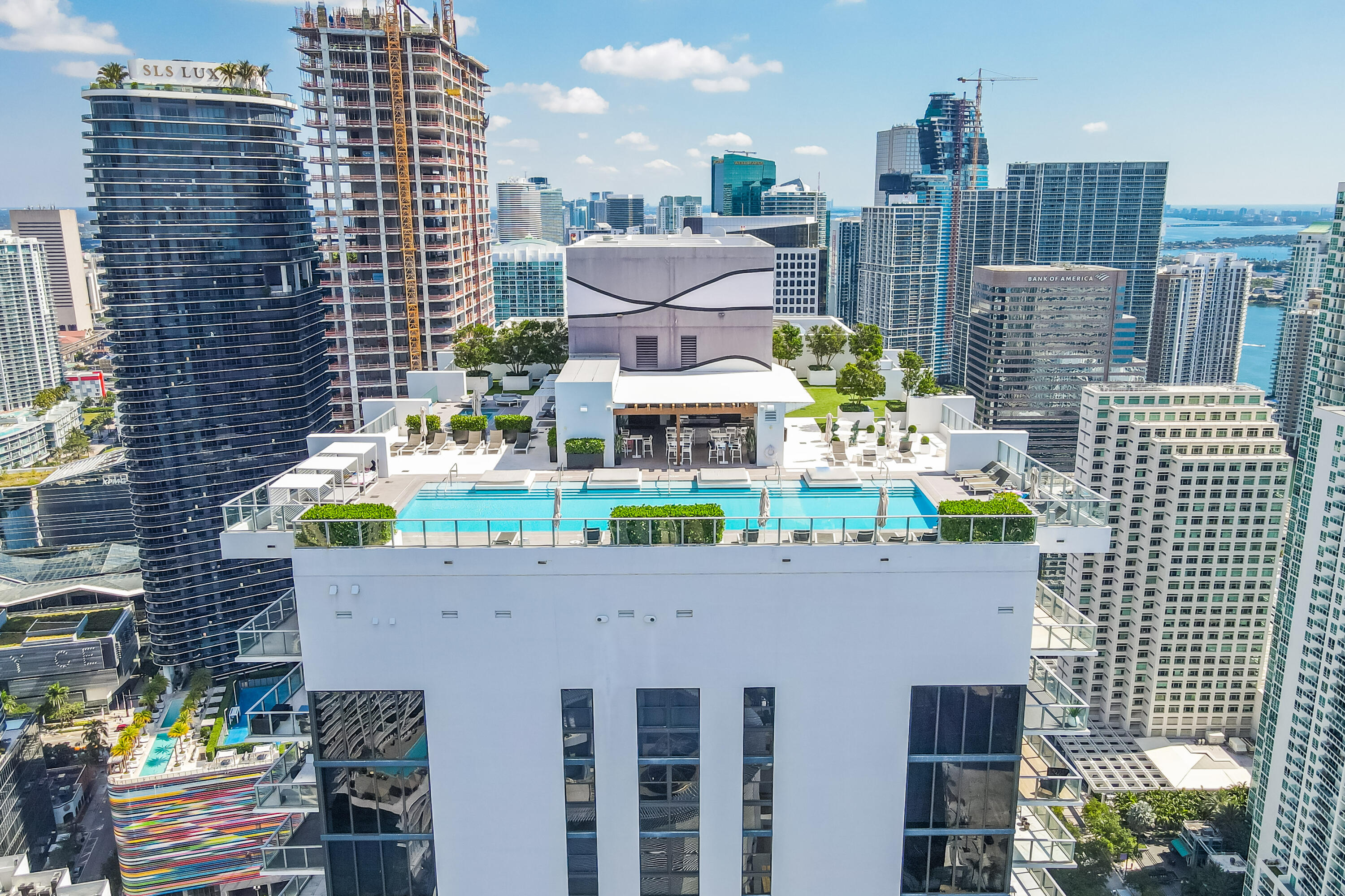 Perched on the 16th floor of 1010 Brickell, this 2-bedroom, 2-bath residence offers two spacious primary suites, expansive city views, and an oversized balcony designed for seamless indoor-outdoor living. Interior features include porcelain tile flooring, custom closets, abundant storage throughout, designer window treatments, 9' ceilings, and an in-unit washer and dryer. One covered garage parking space is included. Residents enjoy an exceptional collection of amenities, including a rooftop pool and lounge, outdoor movie theater, spa, indoor heated pool, fitness center, running track, basketball and racquetball courts, virtual golf simulator, and more. Ideally located moments from Brickell City Centre, renowned dining, shopping, and entertainment.