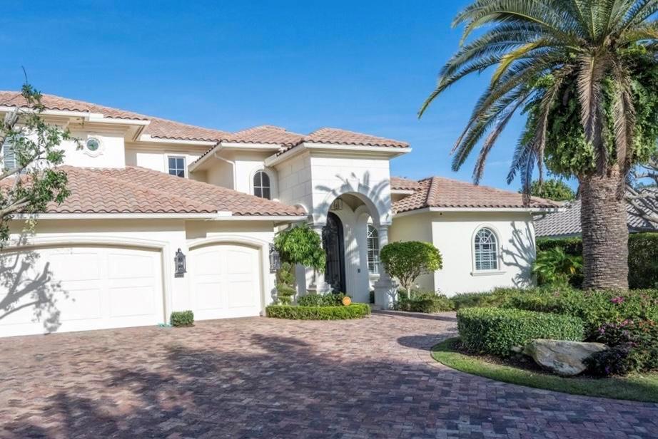 This new estate offering has been exquisitely re-imagined with all the highest quality finishes for today's standard of high-end living!  Incredible opportunity to live in one of the most exclusive communities in East Boca Raton, Royal Palm Yacht and Country Club, featuring a rock solid home built with attention to every detail by SRD Building Corporation.  Beautifully finished and well thought out floor plan with the master bedroom on the first floor featuring his and her completely remodeled full sized bathrooms.  This highly efficient estate home has 4 full en-suite bedrooms and 5 and 1/2 baths, first floor office with built in shelving, refurbished elevator, custom kitchen with designer appliances including Viking 6 burner griddle range, Sub Zero 48'' side by side refrigerator, double convection oven, separate bar area with new filtered ice maker, laundry room with pet shower, natural gas, built in stainless barbeque, new pool heater, newer A/C systems with 4 cooling/ heating zones, central vacuum, Icynene spray foam insulation, and a 3 car garage.   Upstairs are three en-suite guest bedrooms with an oversized loft opening to a large deck overlooking the back yard and pool.  The loft features a bar area with sink and an under counter refrigerator.  All new LED lighting and high end lighting fixtures which allows for the incredibly low cost of electric.  Recently outfitted with remote Vivant Smart home security system and Nest thermostats.  The East facing back yard entertaining and pool area seamlessly integrates indoor- outdoor living space with a gorgeous gas fireplace!
