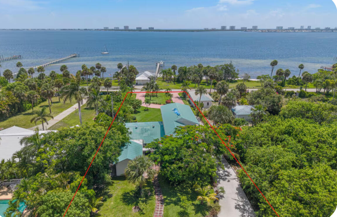 Stunning 3-acre waterfront estate on Indian River Drive! This spacious 3BR/2.5BA home is a boater's dream, offering significant acreage and plenty of room for all your water toys. The open-concept interior is bright and airy, featuring large windows that provide river views from nearly every room. Retreat to the primary suite, complete with an ensuite bath and a private balcony designed for taking in the serene vistas and coastal air. Whether you're entertaining in the fluid living spaces or enjoying the quiet of the riverfront, this property delivers the quintessential Florida lifestyle. Expansive land, deep views, and endless potential. Schedule your private tour today.