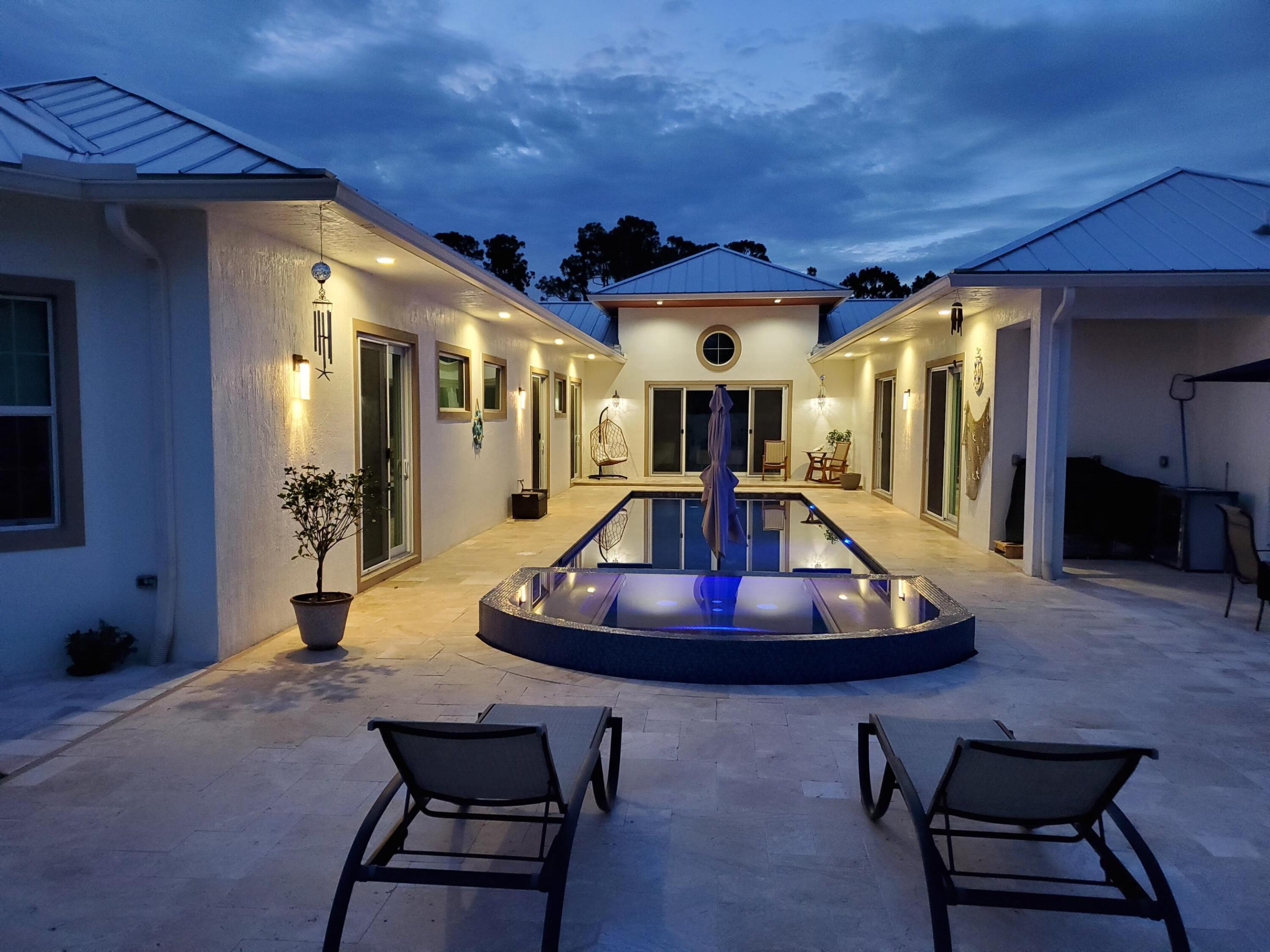 That is your Paradise. Oversize lot. Kitchen and bathrooms with beautiful Quartz.  Metal roof. Unique Desing. Extra-large island in kitchen. extra-large Pool and Jacuzzi. vinyl fence. everting is Unique design. That is your Paradise. Oversize lot. Kitchen and bathrooms with beautiful Quartz.  Metal roof. Unique Desing. Extra-large island in kitchen. extra-large Pool and Jacuzzi. vinyl fence. everting is Unique design.