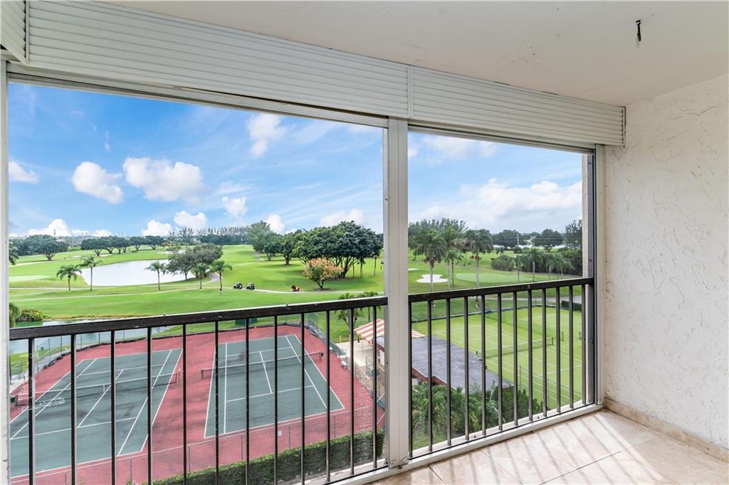 PENTHOUSE! SPECTACULAR PGA GOLF COURSE & LAKE & TENNIS VIEWS. BRIGHT 1BR/1.5BA. Ceramic floors in THE KITCHEN, HALLWAYS, AND BATHROOMS;  NICE LAMINATE IN LIVING AREAS AND BEDROOM. North/South exposure. OPEN KITCHEN! STEPS AWAY FROM POOL, CLUBHOUSE, RESTAURANT AND GOLF PRO SHOP. FREE golf (except cart fees) on two 18 hole courses (PGA & Par3); Amenities include Restaurant, Billiard Room, Bbq/Picnic Area, Clubhouse, Courtesy Bus, Exercise Room, Heated Pool, Library, Putting Green, Sauna, Shuffleboard, Tennis, Pickle Ball, Vehicle Wash Area, Electric Car Charging Station. NO MEMBERSHIP EQUITY! Close to shopping, dining & highways. 15 min. to the beach. Association says 55+ age required. PERFECT GOLF RETREAT!