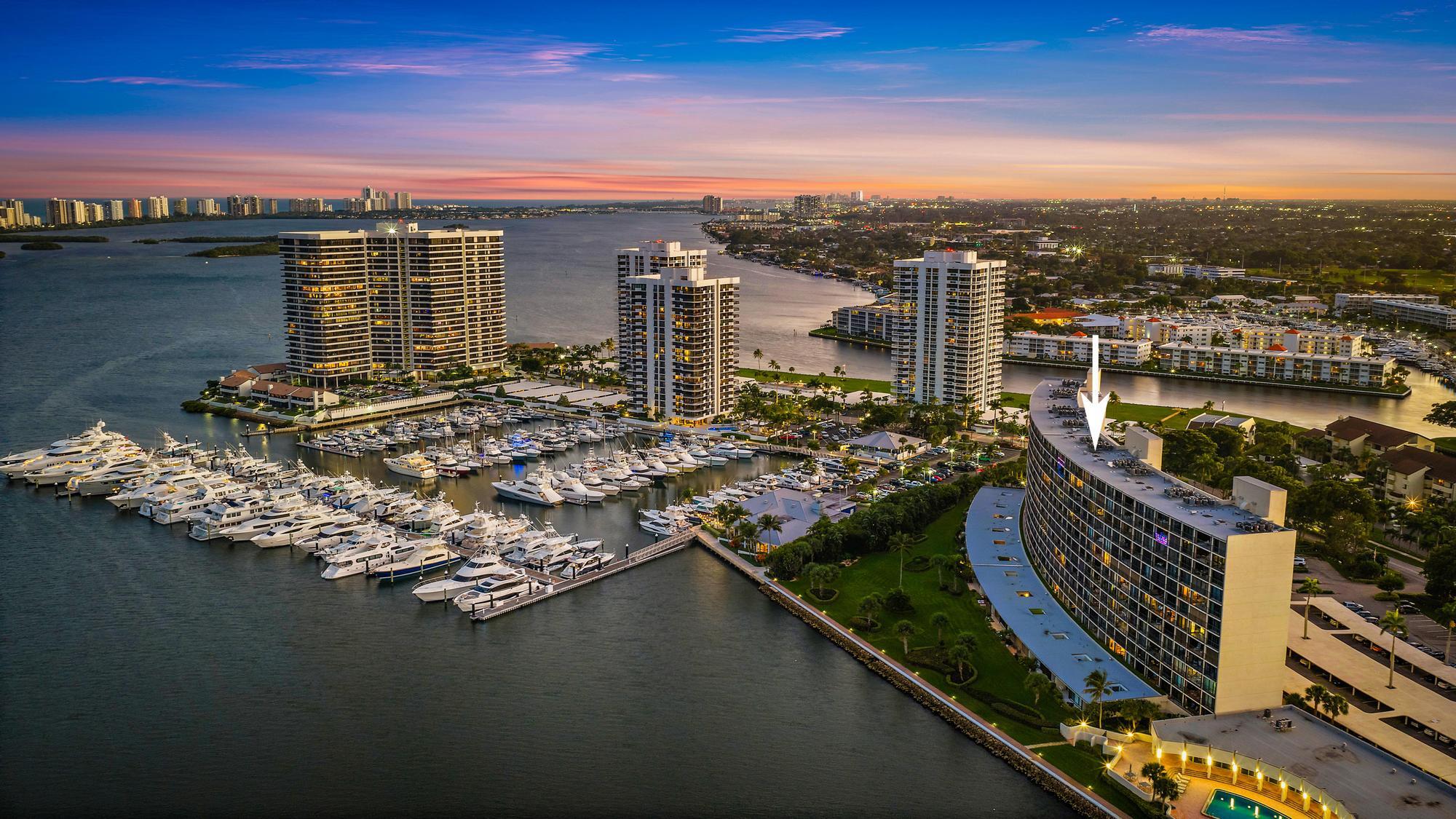 FULLY FURNISHED! $100K IN UPGRADES! Unobstructed, panoramic views of the Ocean, Intracoastal , and marina set the stage for this impeccably renovated residence in the desirable Quay South at Old Port Cove. Wake each morning to breathtaking sunrises enjoyed directly from your private balcony--an experience that never gets old.  Offered fully furnished with high-end designer furnishings, this residence is truly turnkey, with every detail thoughtfully updated. Completed in 2025, the comprehensive renovation includes all-new IMPACT WINDOWS and SLIDING GLASS DOORS (installed December 2025). Major systems have been fully replaced, including a brand-new HVAC system (2025) and 50-gallon water heater (2025). The interior exudes modern coastal elegance, featuring brand-new countertops in both the kitchen and bathrooms, all-new kitchen appliances, updated fixtures and cabinet hardware, fresh designer paint throughout, new interior doors, and a custom-designed primary bedroom closet shelving. Every finish has been carefully selected to deliver both style and function.  Convenience meets luxury with a residence ideally positioned near the elevator, making daily living and package deliveries effortless. The assigned covered carport parking space is also just steps from the elevator, offering exceptional ease rarely found.  Quay South amenities include a heated waterfront pool, his-and-her saunas, fitness center, expansive community room, and library. The Old Port Cove community is renowned for its beautifully maintained waterfront walking path, on-site marina restaurant, and 24-hour manned gatehouse, ensuring both lifestyle and security. Washer and dryers are conveniently located on every floor.  Enjoy walking distance to North Palm Beach Country Club, home to an 18-hole Jack Nicklaus-designed links-style golf course one of only two municipal courses in the United States designed by the Golden Bear along with a pool, 10 Har-Tru tennis courts, and multiple dining venues including the Clubhouse, Grill Room, and Snack Shack. Memberships are available, with discounted rates for local residents.  Perfectly located just five minutes from Singer Island, Ocean Reef Park, and John D. MacArthur Beach State Park, with additional exclusive beach club options available through nearby luxury hotels. Five-star dining, upscale shopping, world-class golf, and miles of pristine beaches are all moments away, while Palm Beach International Airport is just 20 minutes from your door.  This is coastal luxury living at its finest where every detail has been considered, and everything you desire is truly at your fingertips.