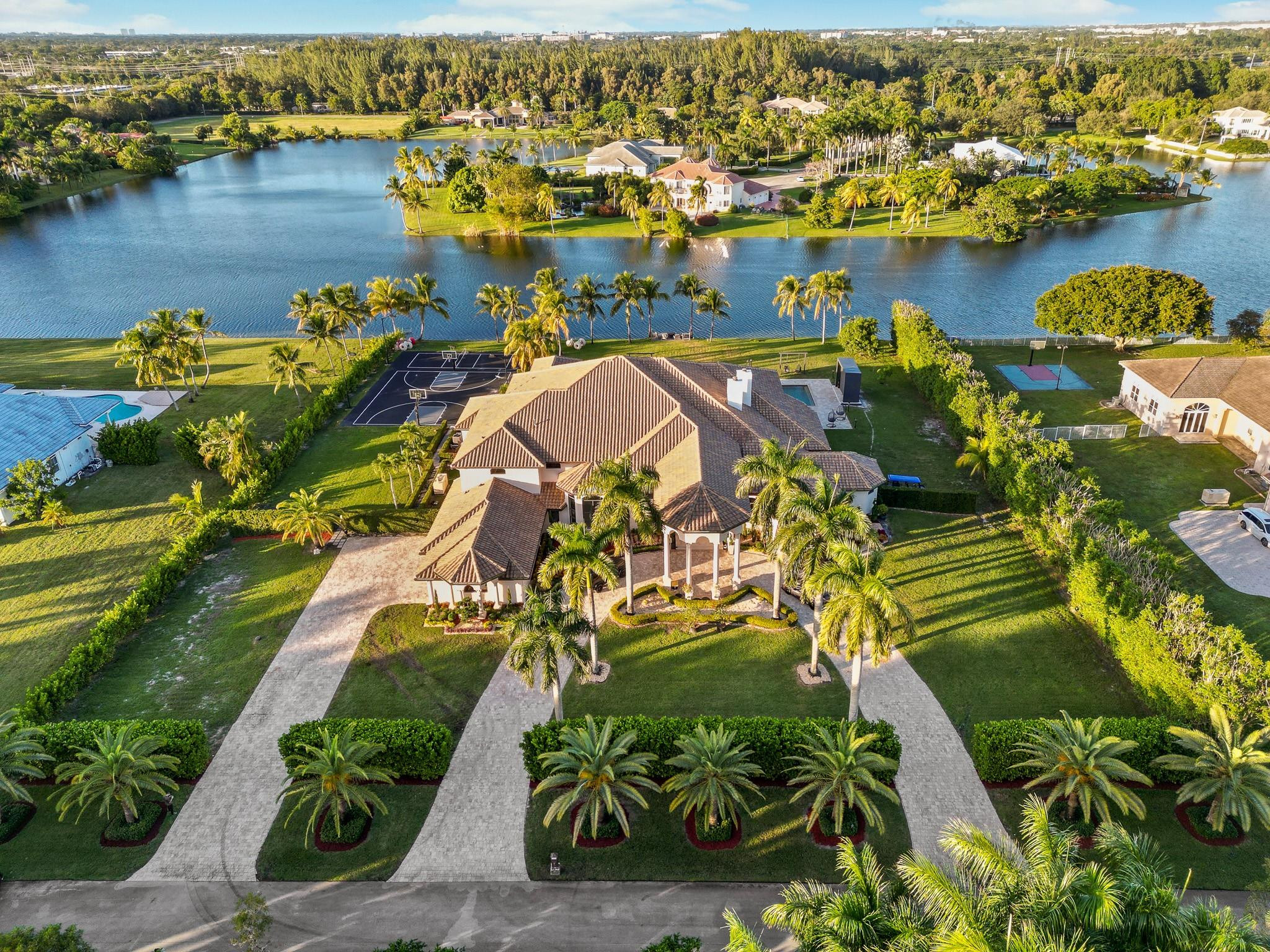 WELCOME TO THE EPITOME OF OPULENCE IN THE HIGHLY SOUGHT-AFTER EXOTIC ACRES, A SUPER-LUXURY COMMUNITY THAT DEFINES PRESTIGE. THIS ULTRA-LUXURIOUS CUSTOM HOME, BOASTING AN IMPRESSIVE 8 BEDROOMS AND 7.5 BATHROOMS, IS A MASTERPIECE OF DETAILED DESIGN. ENJOY THE BREATHTAKING VIEWS OF THE LAKE FROM EVERY ANGLE OF THIS FULLY REMODELED RESIDENCE. THE NEW KITCHEN, ADORNED WITH ULTRA-LUXURY FINISHES, SETS THE STAGE FOR CULINARY DELIGHTS. NEW EXQUISITE TILE FLOORS THROUGHOUT, EVERY INCH OF THIS HOME EXUDES SOPHISTICATION. 14 NEWLY INSTALLED CAMERA SYSTEM WITH A 3-CAR GARAGE ADDING TO THE CONVENIENCE, THIS PROPERTY REPRESENTS THE PINNACLE OF LUXURY LIVING—WHERE EVERY AMENITY AND EXQUISITE FEATURE HARMONIOUSLY CONVERGE TO CREATE A TRULY UNPARALLELED LIVING EXPERIENCE. ***NEW ROOF INSTALLED 2020***