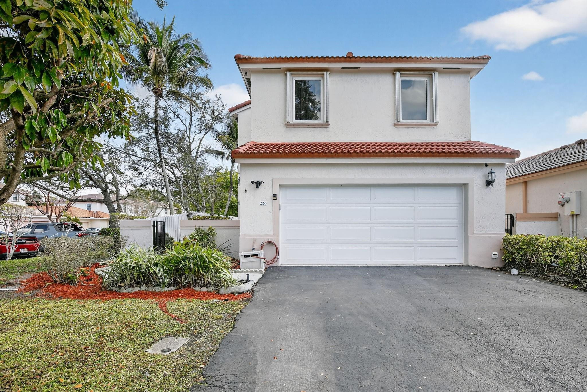 SELLERS MOTIVATED!!!!.   Beautiful corner unit home, is thoughtfully remodeled for your comfort & flare. The home features IMPACT WINDOWS AND DOORS, GARAGE DOOR 2026, ROOF 2023, WATER HEATER 2025, AC 2020. All bathrooms are fully upgraded. The kitchen is smartly remodeled & boast newer high-end stainless appliances. Split bedroom plan, Master bedroom is huge & includes walk-in closet.  Screened-in Porch is perfect for relaxation & entertainment. Garage is tiled. Great amenities, walk to community pool & playground. Lots of guest parking. Variety of tropical fruits including soursop, otaheite Apple, mangoes, pineapples. Very Low HOA with great amenities. Close to Shopping, place of worship, highways, airport.  Easy to show.
