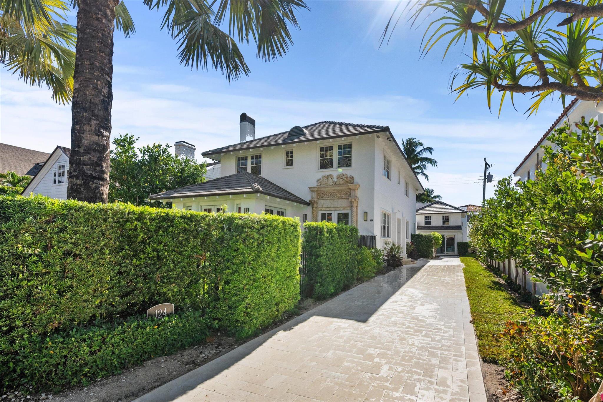 This updated, enchanting, In-town ocean-block home features 3 bedrooms + den/guest bedroom, 4 bathrooms plus 2 bedroom/2 bathroom guest house. Filled with natural light, it offers a seamless flow between the living room, sunroom, dining room, and fabulous kitchen with access to a private rear garden. On the second floor, the spacious master suite includes a sitting room/office, a walk-in closet with an infrared sauna, and a luxurious bathroom. Two additional bedrooms have en suite bathrooms. Impact window/doors throughout, hardwood floors, Ludowici roof. Deeded beach access.