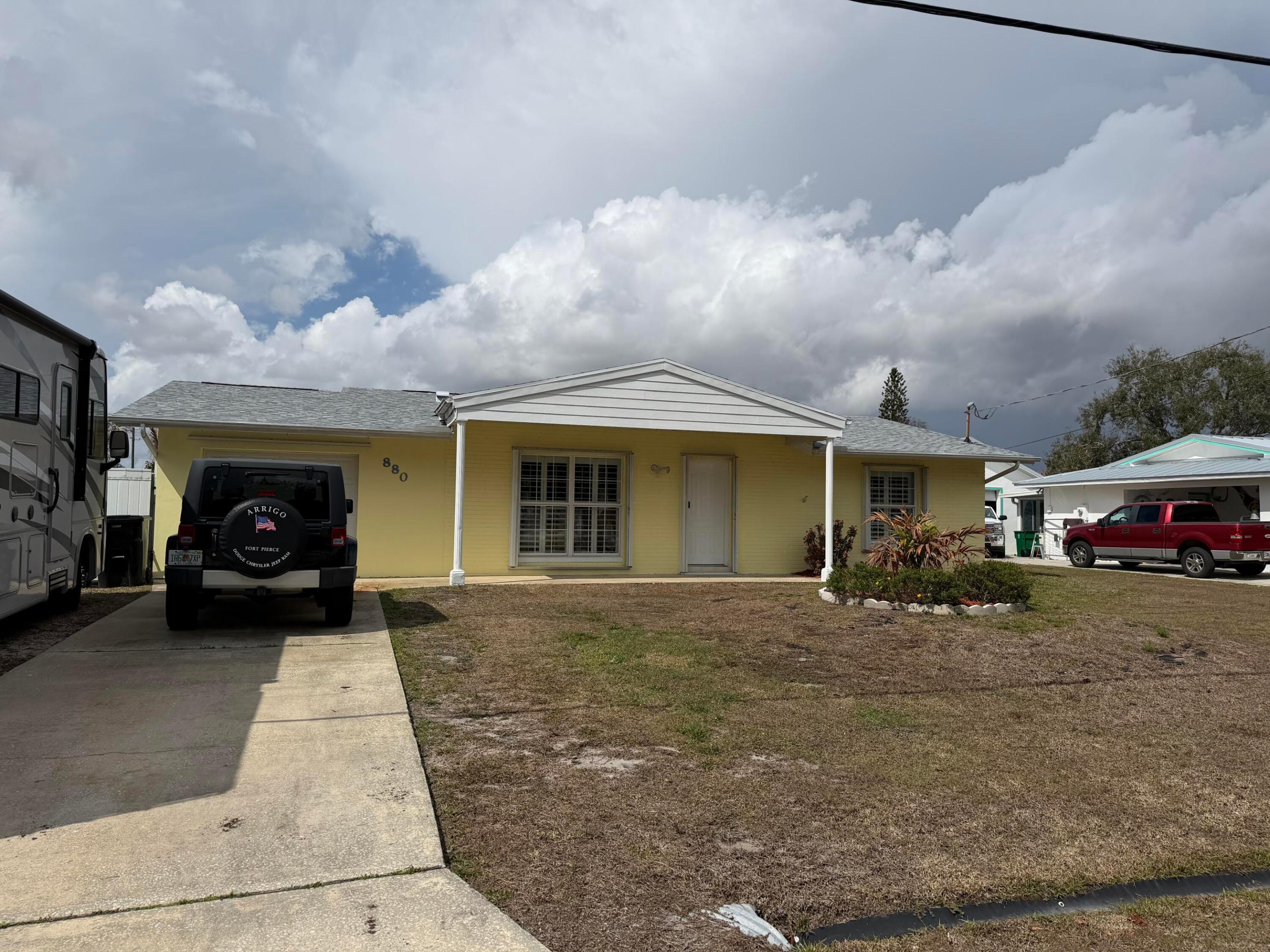 2026 New Dimensional Shingle Roof, new docking and Exterior Paint!  Want a third bedroom?  Lot is large enough to add a third bedroom off the garage towards the back side of the home. Verify with county....Experience Florida living at its finest with this ocean access extra-large almost 1700 SF  2 bedroom 2 bath CBS home updated to include a huge primary bath and bedroom, and extra storage shed.  This tropical oasis features a formal dining room, updated kitchen with stunning blue pearl granite counter and stainless steel appliances breakfast bar, family room that leads to the inviting pool and your private dock.  This home is situated on a fully fenced  ¼ acre lot with a 30 amp 125 volt RV hookup.  Plenty of space for all of your toys to enjoy this luxurious waterfront lifestyle! No HOA 2026 Roof, 2021 AC Condenser and AC Handler, 2024 Dishwasher, 2019 Refrigerator, 2025 Microwave, 2025 Oven, 2 Water Heaters  2023 & 2025, Full Home Accordion Shutters with garage door to pool has steel panels, Interior Paint 3 years, Spa tub motor in primary bathroom replaced in 2025, 30 amp 125 volt RV  outlet