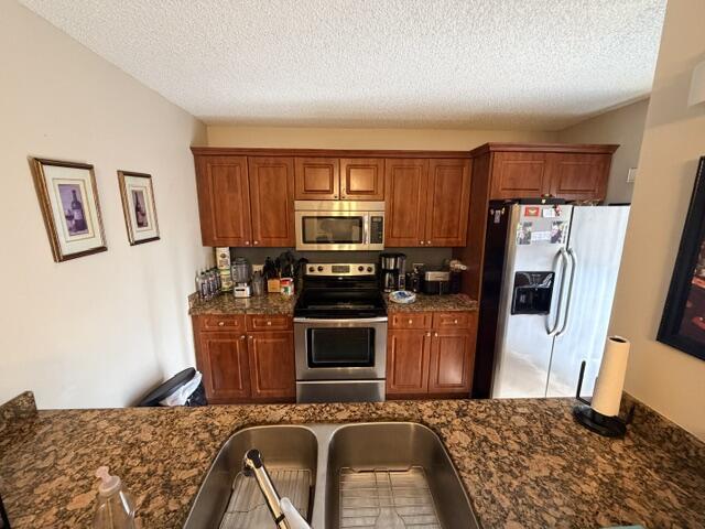 Move-in ready townhome with beautiful water views in one of the best locations in the community! Features an updated kitchen with granite counters and stainless steel appliances, spacious living areas, private gated courtyard, balconies off both bedrooms, and a large primary suite with walk-in closet. Enjoy pools, tennis, basketball, trails, and more, all just minutes from Downtown West Palm Beach.