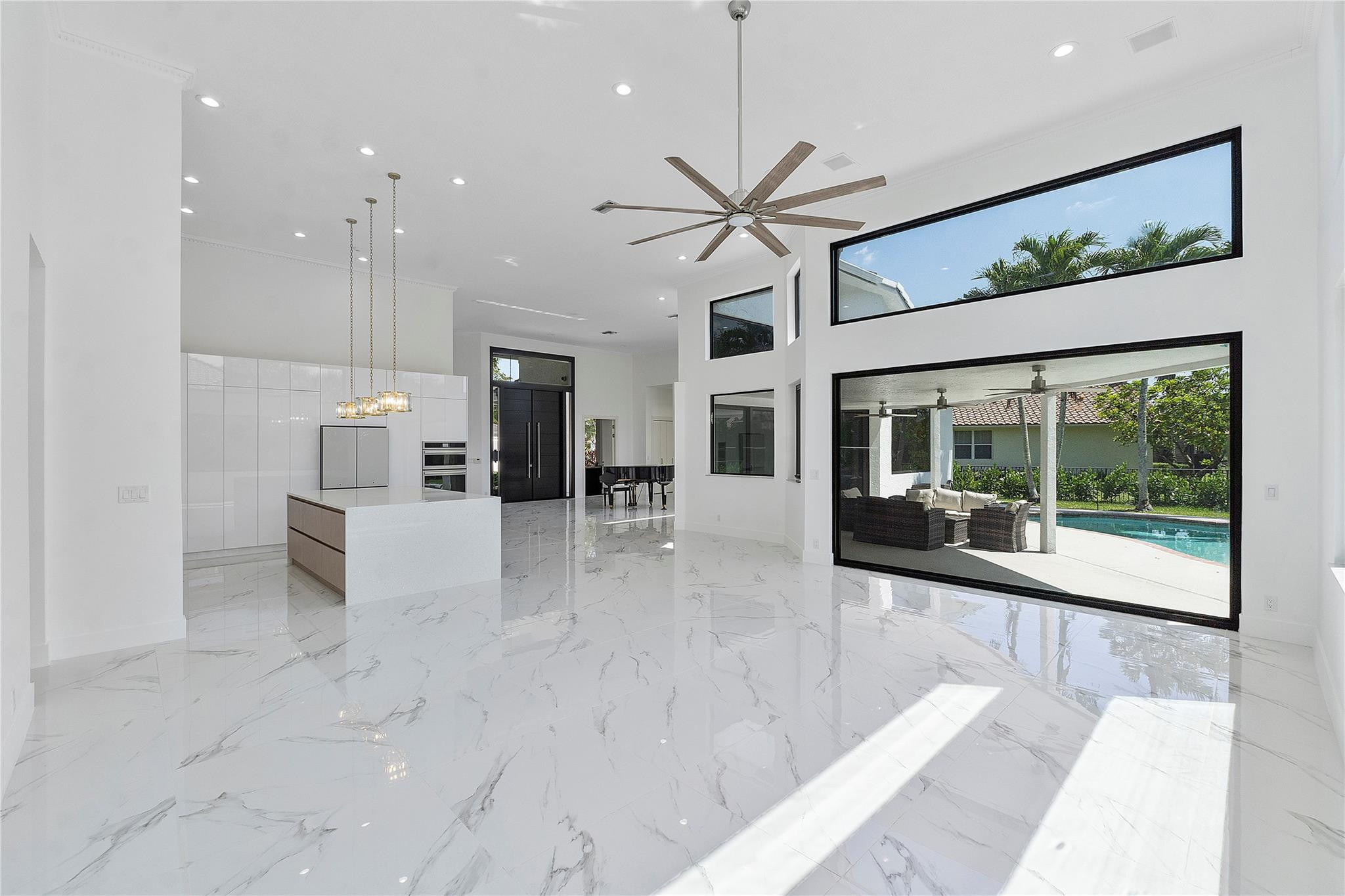 Situated within Palm Island's esteemed guard-gated community, this luxurious residence features 5 bedrooms and 3 FULL bathrooms. Experience luxury living in this meticulously maintained home .The triple split layout ensures maximum privacy, making it perfect for families or for guests. The high ceilings and entryways throughout the home add to the grandeur and elegance of the space. Natural light throughout home creating warm atmosphere. Brand NEW KITCHEN Upscale European design and features, BRAND NEW European style doors throughout , BRAND NEW CLOSESTS , BRAND NEW HIGH IMPACT WINDOWS & DOORS throughout, great sized pool perfect for South Florida summer days. Circular Driveway and featuring a 2 car garage. New Solar Panels !! Make this paradise living your new home!!!!