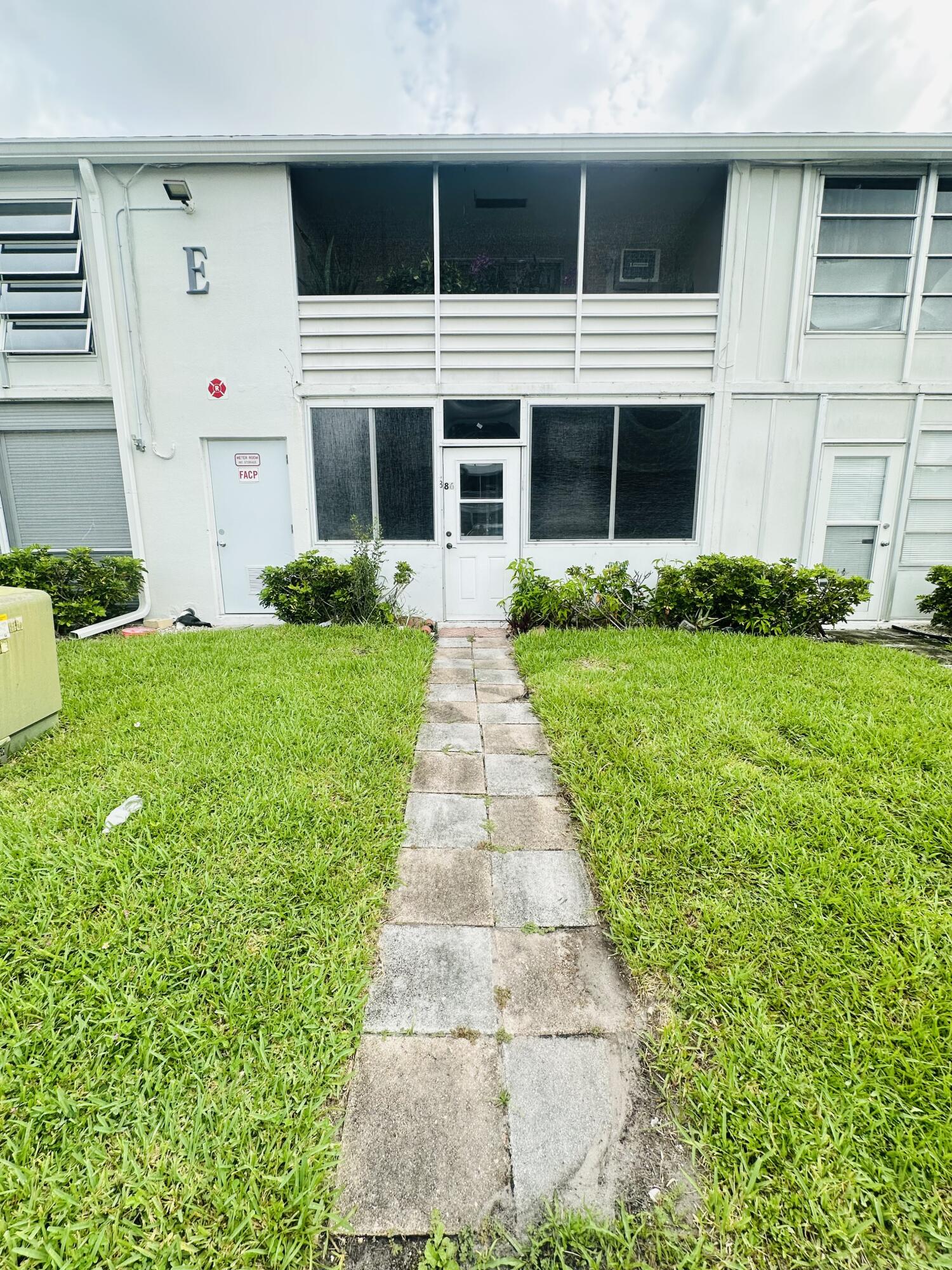 GREAT LOCATION!   In the center of the community,  this cozy 1 bedrm, 1 bath condo is conveniently located on the 1st flr with pkg. rt outside your back door & a lovely canal view from liv rm!!  Features include an updated kit, tile flrs. thru-out, 3 ceiling fans &  tinted liv rm & patio windows.  The bathrm is nicely remodeled w/shower stall & glass shower doors, granite cntr & all tile walls.  Enjoy an encl patio w/ sliding glass windows.  Sold unfurnished ready for you to make it your own! Laundry rm just steps away! Close to shopping, dining & major roadways. Active adult gated comm w/24 hr sec, free bus service, pools. Tennis, pickleball, putting green, cafe, clubhouse w/tons of amenities!  Assoc Claims 55+