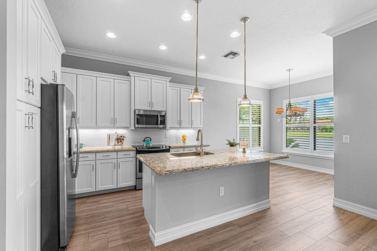 Immaculate and beautifully updated 3/2 single family home w/ 1500 living square feet, a 2 car garage, & a beautiful patio w/ stunning lake views in highly sought after Tuscany North. This move-in ready home has a gorgeous white kitchen w/ granite countertops, a large island, & stainless steel appliances. Additional updates include all impact windows & doors, a stone accent wall, porcelain ''wood plank'' tile throughout, updated bathrooms w/ Carrara marble counters, built-in closet organizers in all bedrooms, plantation shutters, remote control fans, electric shades, epoxy garage floors w/ overhead garage storage, & an extended patio overlooking the lake w/ an outdoor tv. Amenities include a resort-style pool w/ cabanas, tennis courts, pickleball, outdoor basketball courts, & so much more.