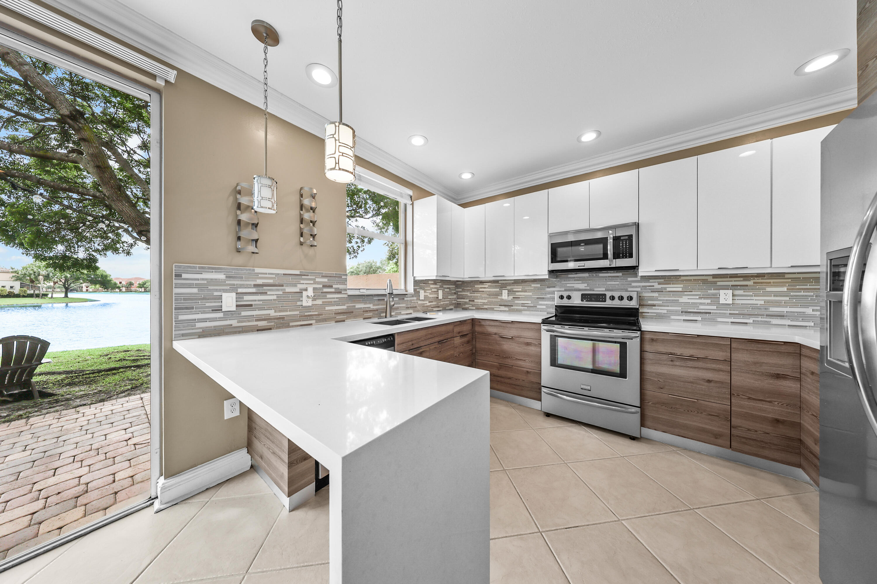 !LOCATION! Beautiful lake-view townhome in the gated community of Riviera Isles. Seller is highly motivated! Fully renovated with Italian-style kitchen cabinetry, stainless steel appliances, and new central A/C (2022). Features crown molding, ceramic flooring on the first floor, and elegant laminate flooring throughout the second floor and bedrooms (no carpet). Renovated bathrooms with modern finishes. Spacious primary suite with walk-in closet, soaking tub, and separate shower. Includes blackout roller shades, wood blinds, full-size W/D, large storage room, 1-car garage, double paver driveway, and guest parking. Resort-style pool, playground, near shopping, I-75, and A-rated schools. Lease expires May 31st, after which the property will be in excellent condition and ready for sale. Photos Property is ideally located in prestigious West Miramar, close to restaurants, shopping centers, supermarkets, and major conveniences, offering both comfort and accessibility in a highly desirable area.