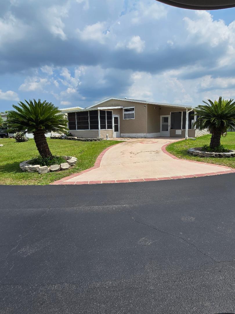 Really nice manufactured home on corner lot. Nicely landscaped.  Move in ready. Very well kept. Metal roof. Beautiful kitchen. Tile floors. Master Bedroom laminate.  All appliances convey.