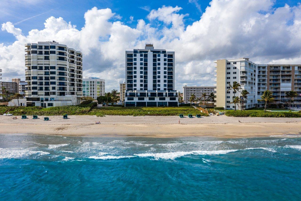 Boutique oceanfront living in prestigious Highland Beach. This impeccably designed 3-bedroom, 2.5-bath residence offers a refined modern coastal aesthetic within an exclusive beachfront building. The expansive open-concept layout is enhanced by porcelain wood-look flooring throughout. The gourmet kitchen is appointed with granite countertops, premium stainless-steel appliances, and custom cabinetry. Enjoy sweeping views of both the Atlantic Ocean and Intracoastal Waterway from the main living areas and breakfast nook. The spacious primary suite serves as a private retreat, complete with custom-designed closets and a spa-inspired bath. Just beyond your front door, pristine sandy beaches await.