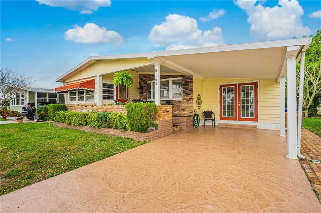 UPDATED MANUFACTURED HOME, OWN YOUR LAND IN AN ADULT (55+) COMMUNITY, . BRIGHT OPEN KITCHEN WITH GRANITE COUNTERTOPS & SNACK BAR, SPACIOUS LIVING ROOM WITH BONUS AREA, UPDATED MASTER BATH, PLANTATION SHUTTERS THRU-OUT THE HOME, FRENCH DOORS, TILE AND WOOD LAMINATE FLOORING.  NEW INDOOR & OUTDOOR ELECTRICAL BOXS, WATER HEATER NEW IN 2019, A/C NEW IN 2017, NEW DISHWASHER, ROOF RECENTLY SEALED. TEXTURED DRIVEWAY AND SIDEWALK, PLUS PAVER WALKWAY ON THE SIDE OF THE HOUSE.  ALSO, OPEN PATIOS IN THE FRONT AND BACKYARD.  NO LEASING FIRST 2 YEARS OF OWNERSHIP, OK TO LEASE AFTER THAT FOR A MAX OF 6 MONTHS - NO ANNUAL LEASES.