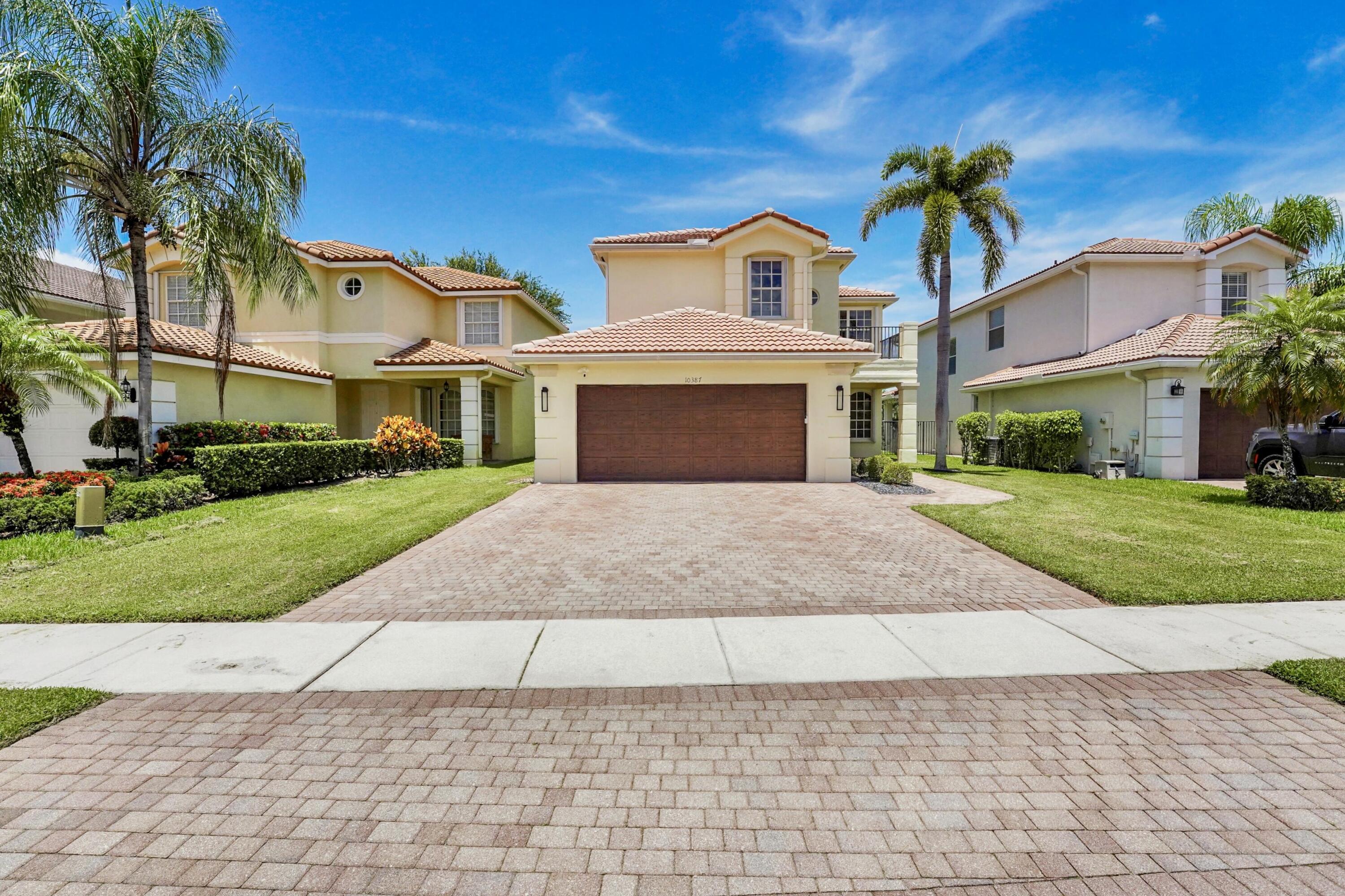 This beautifully maintained 4-bedroom, 2.5-bathroom home provides 2,515 square feet of thoughtfully designed living space with stunning direct lake views, and carefully selected upgrades - all within one of West Boynton Beach's most sought-after gated communities.  The open kitchen features granite countertops and backsplash, an app-enabled slide-in range with dual split ovens, a Wi-Fi connected dishwasher, and a newer microwave - all updated within the last two years. For privacy, all four bedrooms are upstairs - including a luxurious primary suite with ensuite bathroom, his-and-hers walk-in closets, and serene lake views. A unique feature of this property is an additional fully air-conditioned flex room that serves as a dedicated home office or additional living space .  The home has been recently upgraded with connected home features throughout including an app-enabled thermostat, automated lights and outlets, keyless entry lock, remote-access garage door opener, pre-wiring for a whole-home generator and EV charger, and a tankless water heater. Out front, extended pavers widen the driveway for a spacious two-car experience. Out back, a beautiful extended paver patio overlooks the lake, with ample room to add a pool. The home is equipped with a hurricane-impact entry door and garage door, plus accordion shutters on all windows and sliding doors - providing complete storm protection and potential insurance savings.  Canyon Lakes residents enjoy a 24-hour manned gate, resort-style pool with splash pad, fitness center, yoga/dance studio, activity room, event room, three recently updated playgrounds, and scenic walking and biking trails. Steps away, Canyon Town Center provides dining, shopping, and everyday conveniences, and a brand new neighborhood park with a playground and sports fields is just a short walk away. Top-rated Palm Beach County schools and easy highway access complete the picture.