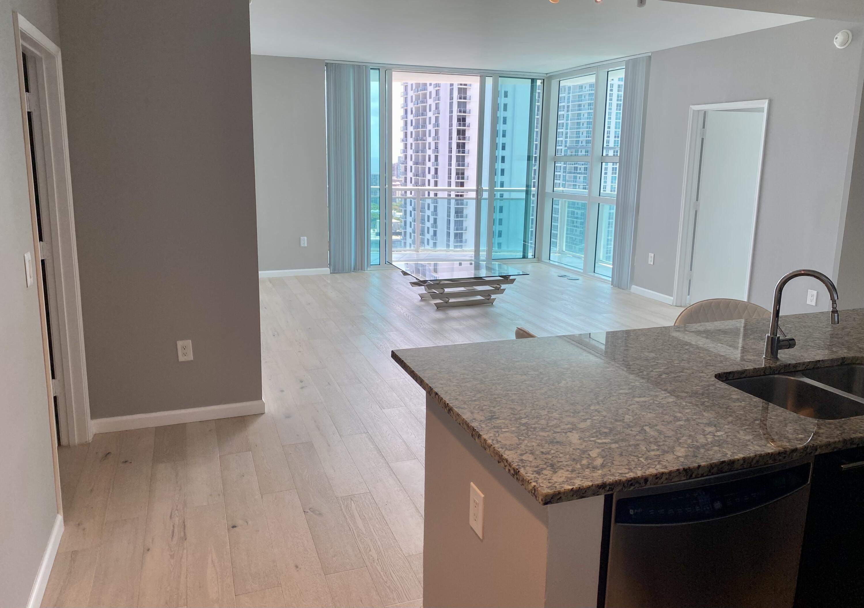 Spectacular corner residence with panoramic bay & skyline views through floor-to-ceiling glass. Bright split 2BR/2.5BA layout offers privacy and seamless living. Private balcony with water & city views. Wood floors, assigned covered parking. Full-service building with concierge, valet, resort-style pool & fitness center. Prime Brickell location steps to dining, shopping & entertainment. THIS UNIT IS ALREADY APPROVED AT 3% DOWN.