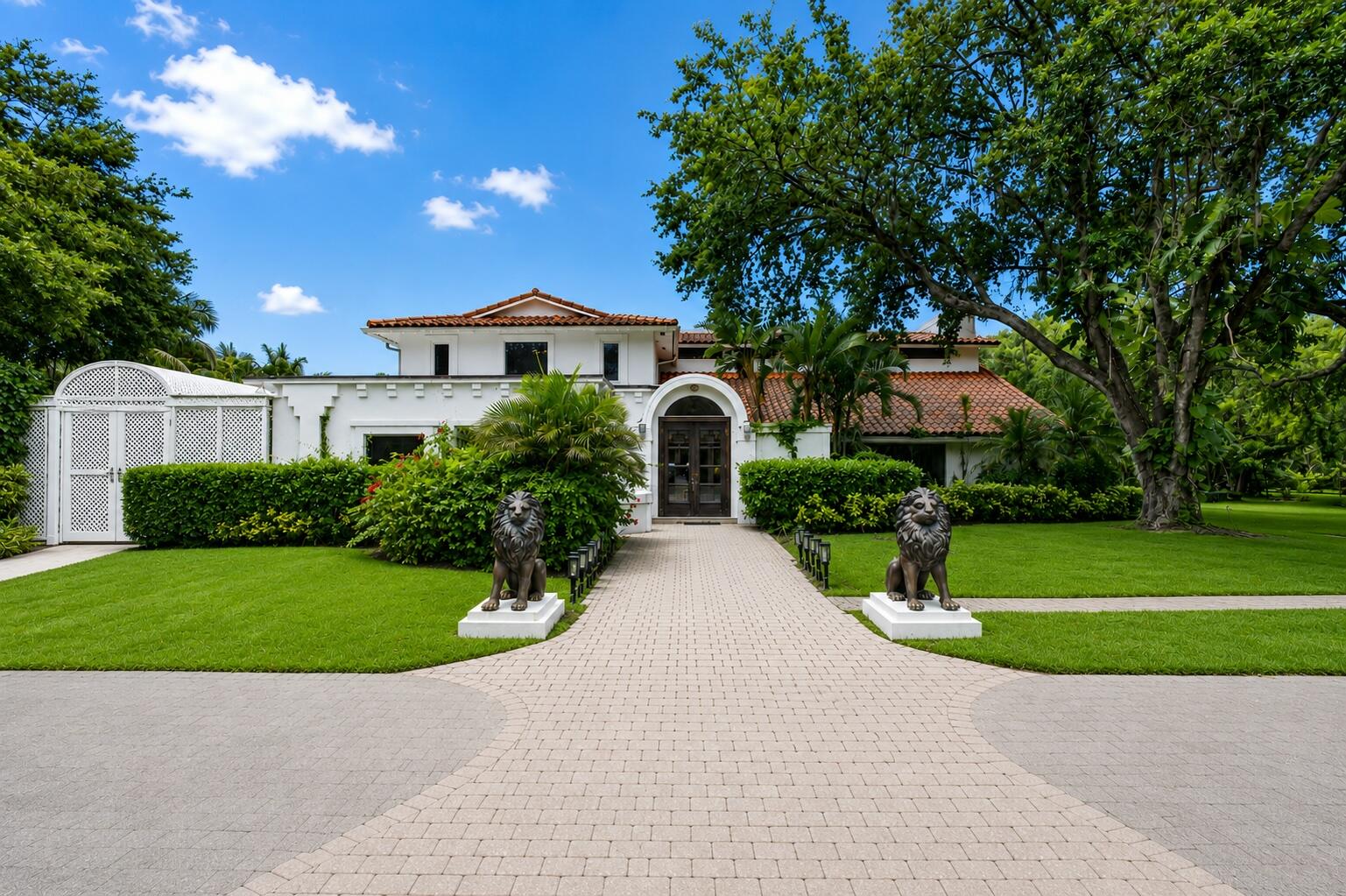 Experience private estate living within the gated equestrian community of Fox Trail. 1030 Arabian Drive situated on 5.12 private acres. The main home features 5 bedrooms, 4 full baths, and 2 half baths, along with expansive entertaining areas, a private pool, and a large porch designed for relaxed indoor-outdoor living. A detached 2-car garage includes a private guest suite complete with a full bath, kitchenette and laundry, ideal for extended family, guests, staff quarters, or a home office. Surrounded by mature landscaping and neighboring acreage estates, the property offers exceptional privacy with ample room for equestrian amenities, recreational use or future expansion. Enjoy the residence as-is, thoughtfully renovate or expand, or create a custom estate tailored to your vision and lifestyle.   Additional opportunity available with the adjacent property at 1029 Arabian Drive and a neighboring vacant 5+ acre parcel also being offered for sale, creating exceptional potential for a larger family compound, private equestrian estate, multigenerational retreat or investment assemblage. Conveniently located near Lion Country Safari, the rapidly growing communities of Westlake, Arden, the future Silver Lake and Village Landing development, residents enjoy easy access to Wellington International, shopping, dining, and approximately 30 minutes to the heart of Palm Beach. Ideal for full-time living, seasonal enjoyment, equestrian pursuits, or long-term investment potential in one of South Florida's expanding acreage corridors.