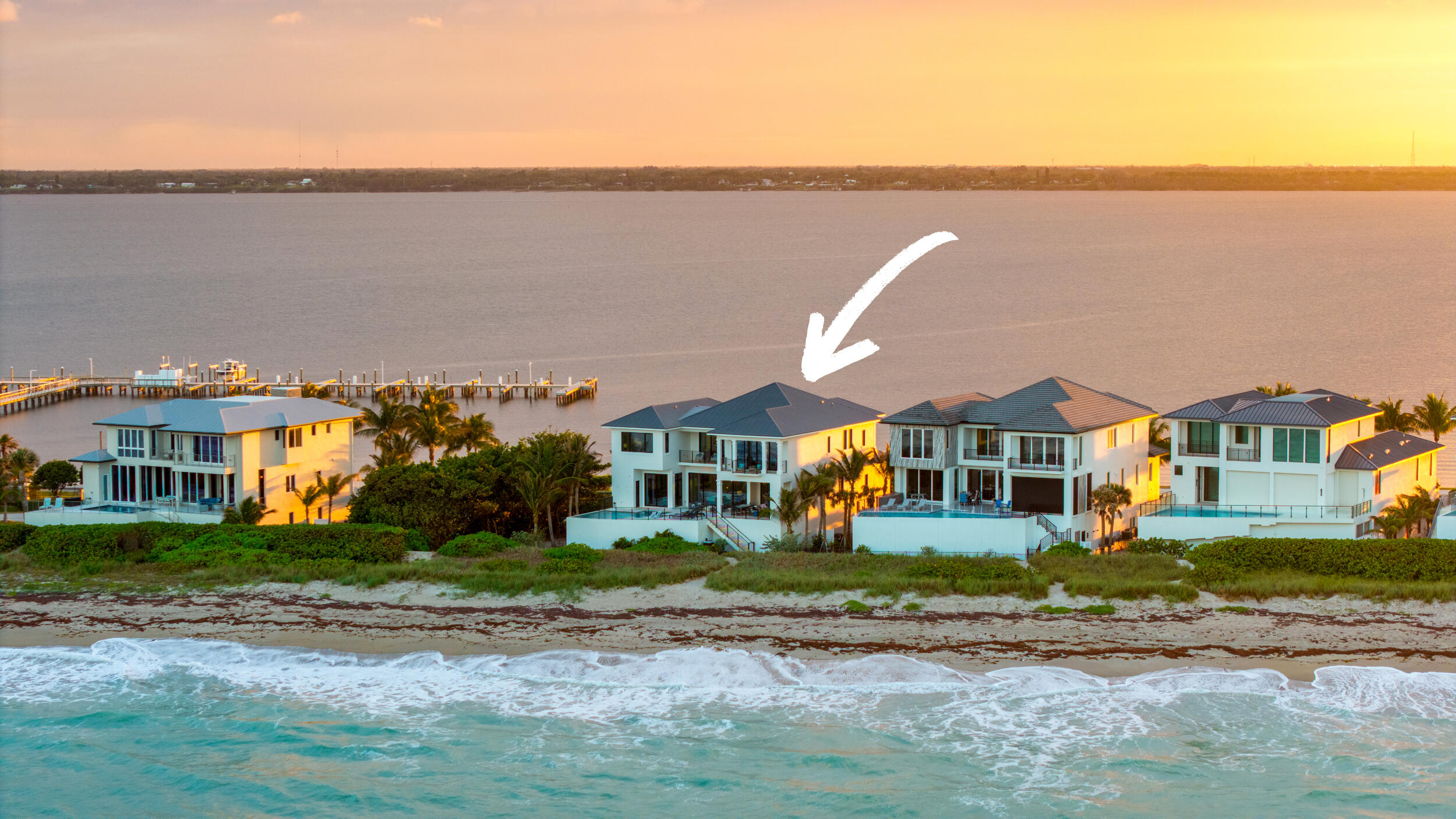 Ocean to Intracoastal, a rare 2020-built coastal estate delivering true dual-waterfront living. Sited for sunrise over the ocean and sunset across the river, nearly every room frames sweeping water views. Just under 8,000 sq ft of refined interiors by Masterpiece Interiors, where every stone, wood & finish was personally hand-selected. Walls of glass dissolve the line between indoors & out, while a private elevator serves all levels with ease. The amenity program is uncompromising: a restaurant-caliber chef's kitchen, built-in bar, game room, walk-in wine cellar, custom movie theater, dedicated gym, built-in sauna, resort-caliber pool & spa, outdoor fireplace, multiple balconies overlooking ocean & Intracoastal, four-car garage & direct private beach access. Newer construction, dual frontage & master-designed interiors converge in a residence that rarely comes to market. Wake to the ocean, dine to the sunset & step barefoot onto the sand without ever leaving home.