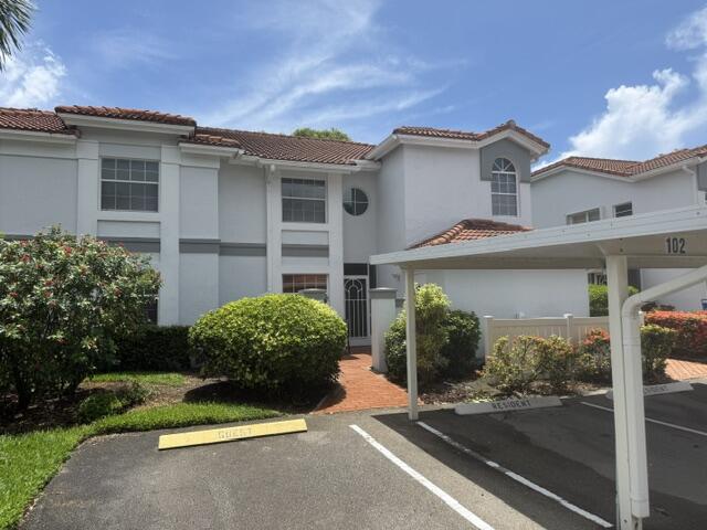 Welcome to Palm Isles, one of Boynton Beach's premier gated 55+ communities, where resort-style living meets exceptional value. Priced to sell, this spacious first-floor waterfront residence offers approximately 1,616 square feet of comfortable living space, featuring 3 bedrooms, 2 bathrooms, tranquil lake views, and a large glass- and screen-enclosed patio—perfect for enjoying your morning coffee or relaxing while taking in the peaceful waterfront setting. Lovingly maintained by its original owner, this home is clean, well cared for, and offers an outstanding opportunity for the next owner to personalize and update to their own style. The thoughtfully designed floor plan features generous living and dining areas filled with natural light, while tile flooring extends throughout the main l living spaces for easy maintenance. The spacious kitchen offers ample cabinetry, abundant counter space, and plenty of storage. A separate laundry room with a full-size washer and dryer adds everyday convenience. The primary suite serves as a private retreat with serene lake views, a walk-in closet, dual vanities, and a walk-in shower. Two additional bedrooms provide flexibility for guests, a home office, or hobby space. Additional highlights include covered parking just steps from the front door, a private exterior storage closet, and a desirable location near one of the community's satellite pools, making it easy to enjoy a refreshing swim or relax in the Florida sunshine. Palm Isles is renowned for its recently renovated multi-million-dollar clubhouse and exceptional recreational facilities. Residents enjoy a state-of-the-art fitness center, indoor and outdoor swimming pools, five community pools including satellite pools, Har-Tru tennis courts, a thriving 10-court pickleball complex, shuffleboard, billiards, card rooms, arts and crafts studios, ceramics, a grand ballroom, a 600-seat performing arts theater, and an on-site café serving breakfast and lunch. A full calendar of social events, clubs, and activities ensures there's always something to enjoy. The monthly maintenance fee includes cable, water, roof maintenance, insurance, security, and access to the community's outstanding amenities, providing exceptional value and peace of mind. Conveniently located with easy access to Florida's Turnpike and I-95, Palm Isles is just minutes from Bethesda West Hospital, Whole Foods, Canyon Town Center, Cobblestone Commons, Delray Marketplace, shopping, dining, and South Florida's beautiful beaches. Whether you're searching for a peaceful waterfront retreat or an active resort-style lifestyle, this priced-to-sell residence presents an exceptional opportunity to make it your own in one of Boynton Beach's most desirable active adult communities. You're not just purchasing a home—you're embracing the ultimate South Florida lifestyle.