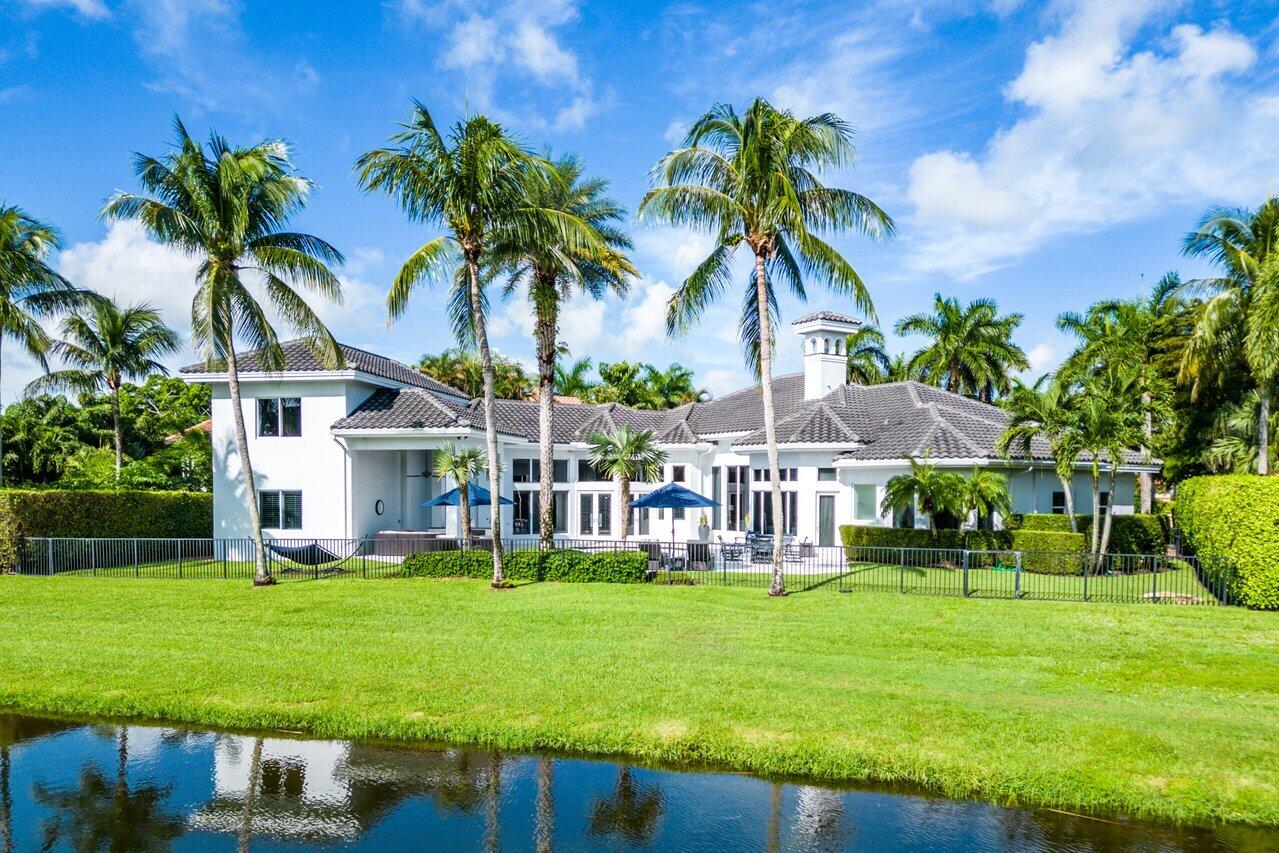 This Spectacular Country Club, Lakefront Compound  encompasses 7433 total sq/ft presenting 4 Bdrm Suites, 2 Home Offices, a Home Gym, a Club Room/Bonus Room, Wine Storage, a Media Room, plus a Waterfront Resort-Style Pool, Spa & Covered Outdoor Summer Kitchen Sure to Impress the Most Discerning Buyer! The Stately Primary Bedroom revels in glistening Lake Views, offers Two Extraordinary & Generous Organizational Dressing Rooms & Two Luxurious Bathrooms and a Steam Shower. All Single Story Living, except Media Room (w/ Elevator access) and the 4th Bedroom Suite.  A Fabulously Equipped Kitchen is an Epicurean's Delight featuring Natural Gas Stovetop, an Oversized Island. Light-filled Estate w/ SE Exposure, Impact Windows & Doors, 2016 Roof, Saltwater Pool, and 3-Car Garage Live in one of the Most Preferred Woodfield CC subdivisions, Windsor Bay, located across from all Club Amenities!  Woodfield Country Club is the most sought-after Country Club in Boca Raton within an 830-acre gated site designed so that each community enjoys sparkling lakes and the meandering holes of Woodfield's brand-new course designed by Kipp Schulties.  The course features a dynamic layout with large, gently moving fairways and dramatic bunkers with an overall yardage of 7,200 yards from the Championship Tee. Woodfield CC also offers residents a 38,000 sq. ft. Cascades Fitness Complex, a Pool Complex featuring a 12,000 square foot lagoon-style heated swimming pool and a separate lap pool, and a luxurious Spa exclusive to its members that offers favorite relaxation therapies, and Seven Dining Outlets that serve up everything from poolside bites and family fare to elaborate buffets and elegant dinners.
Invitation to membership is extended ONLY to property owners in the Woodfield communities. Mandatory Membership Equity: Standard: $60,000 non-refundable initiation, $38,000 equity bond (25% refundable), $21,761 annual dues, $2500 annual food & beverage OR Full (Golf): $80,000 non-refundable initiation, $45,000 equity bond (25% of $38,000 refundable), $28,564 annual dues, $2500 annual food & beverage. Waiting List for Golf Membership. Info contained herein is deemed reliable but subject to errors, omissions, or changes without notice.