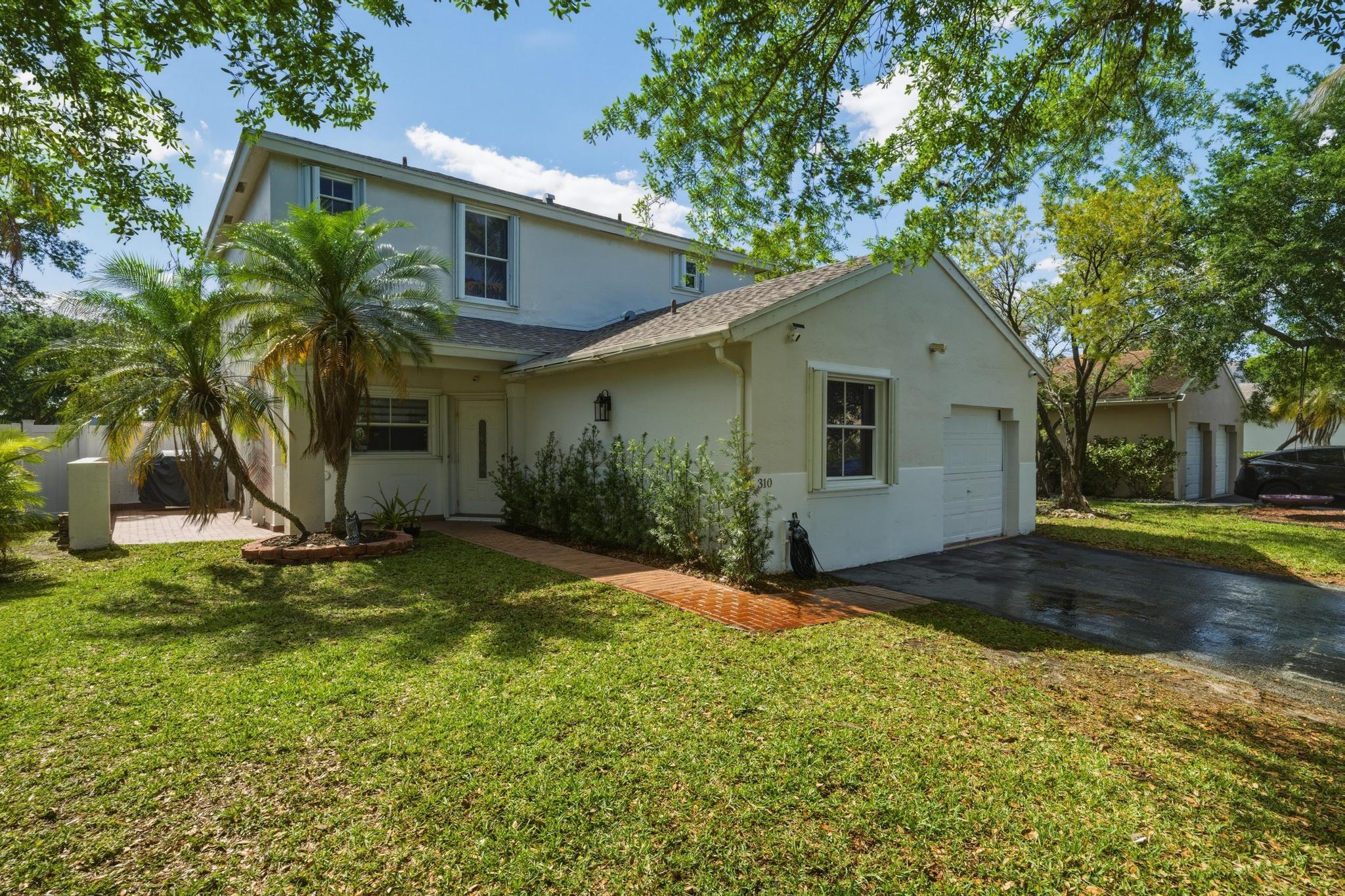 A beautifully updated single-family home featuring 4 bedrooms and 3 bathrooms. The gorgeous kitchen, remodeled in 2025, showcases top-of-the-line appliances, stunning quartz countertops, and elegant cabinetry with smooth-gliding drawers. The bathrooms have also been tastefully remodeled. Enjoy the spacious backyard with a fantastic covered patio—perfect for entertaining or relaxing. The property includes a covered garage for one vehicle plus additional uncovered parking for two cars. Located within walking distance of some of Southwest Broward County's highest-rated "A" schools, this home offers access to all the amenities of the serene and desirable Chapel Trail community. Exceptionally priced based on comparable homes.