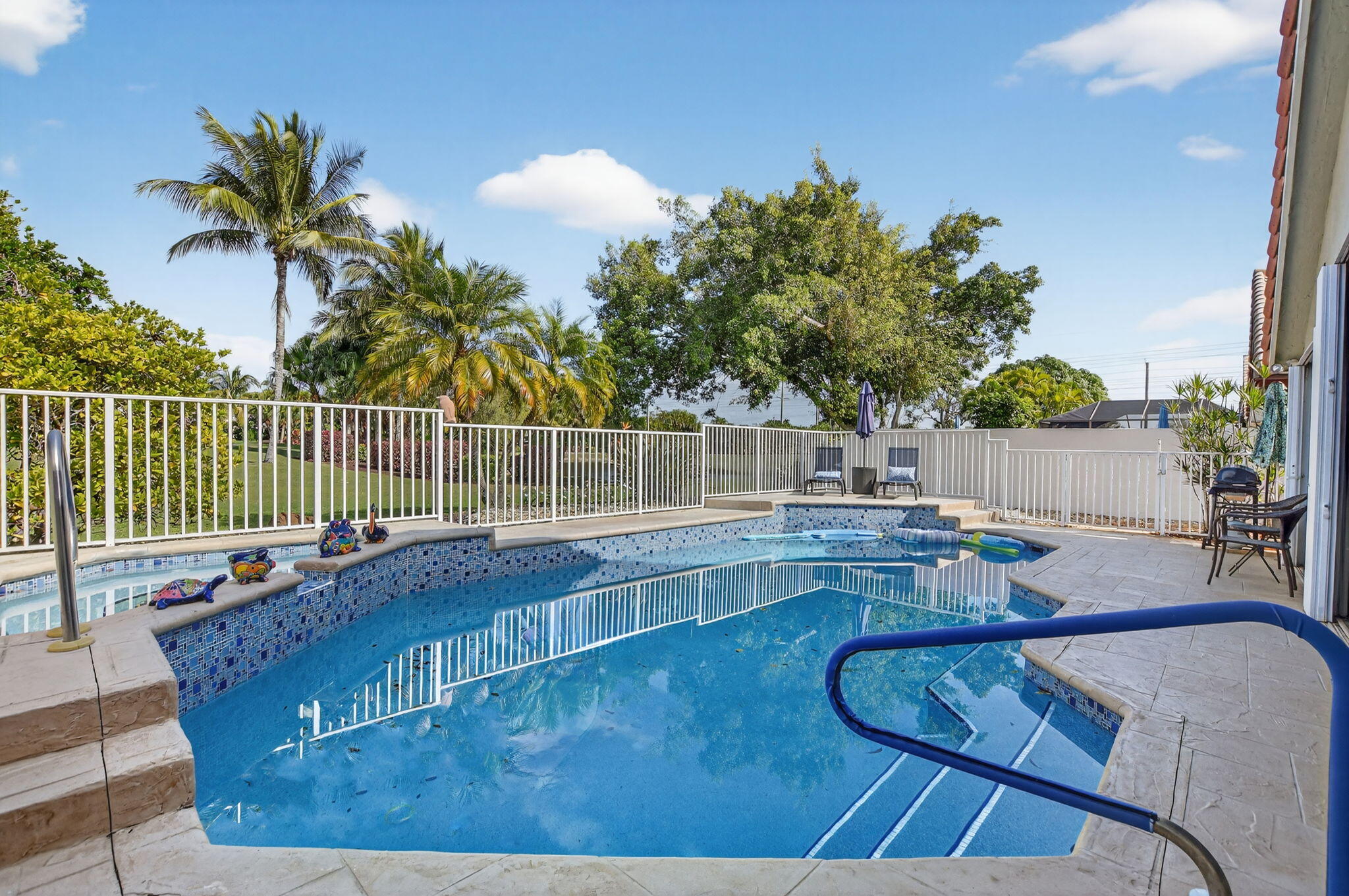 LUXURY LIVING at OUTSTANDING VALUE!  Beautifully renovated and meticulous 3BR/3BA POOL home with MAGNIFICENT LAKE & PRICELESS GOLF COURSE VIEWS in the prestigious Boca Woods Country Club. Enjoy serene views of the redesigned Rees Jones Woods golf course from your private, fenced in pool area.  The residence features porcelain & laminate flooring, FULL CABANA BATH with OUTDOOR SHOWER, NEW  KITCHEN CABINETS, COUNTERTOPS & BACKSPLASH, NEW A/C SYSTEM, NEW POOL HEATER, COMPLETE HURRICANE IMPACT WINDOWS & DOORS, PLUS accordion shutters to provide DOUBLE PROTECTION for peace of mind. Boca Woods Country Club offers exceptional amenities with two championship golf courses, Har-Tru tennis courts, pickleball, state-of-the-art fitness center, clubhouse, and fine dining.