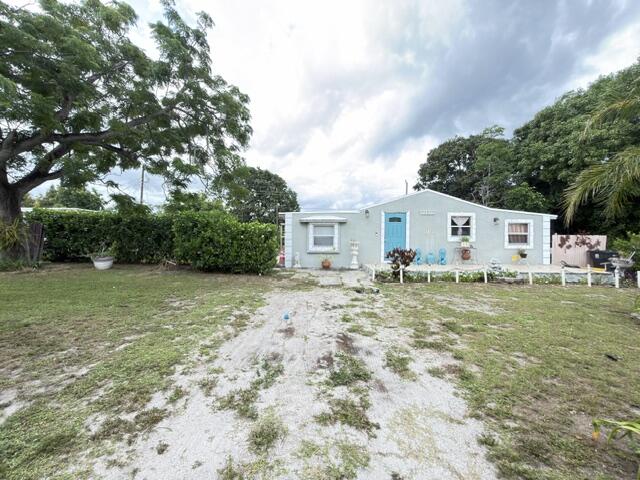 Rare opportunity to own a home on an oversized 0.28-acre lot in Boynton Beach, nearly double the size of many neighboring properties. No HOA, low current property taxes, and Residential Multi-Family zoning offer exceptional flexibility and future potential. Tax records reflect a 2BR/1BA home currently configured as a functional 4BR/1BA. The property features mature mango, avocado, quenepa, and guanábana fruit trees, plus front and rear decks. Roof replaced in 2022 and septic system recently serviced. Conveniently located minutes from the beach, shopping, dining, and major destinations in Delray Beach and West Palm Beach. A unique opportunity for homeowners and investors alike. Additional Remarks Tax records reflect 2BR/1BA; home is currently configured as a functional 4BR/1BA. Buyer to verify permits, legal use, zoning, square footage, and all measurements. Residential Multi-Family zoning. No HOA. Low current property taxes. Roof replaced in 2022. Septic system recently serviced (November). Minutes from the beach, shopping, dining, Atlantic Avenue, and CityPlace. Oversized 0.28-acre lot compared to many neighboring lots of approximately 0.14 acres or less. Mature fruit trees: mango, avocado, quenepa, and guanábana.