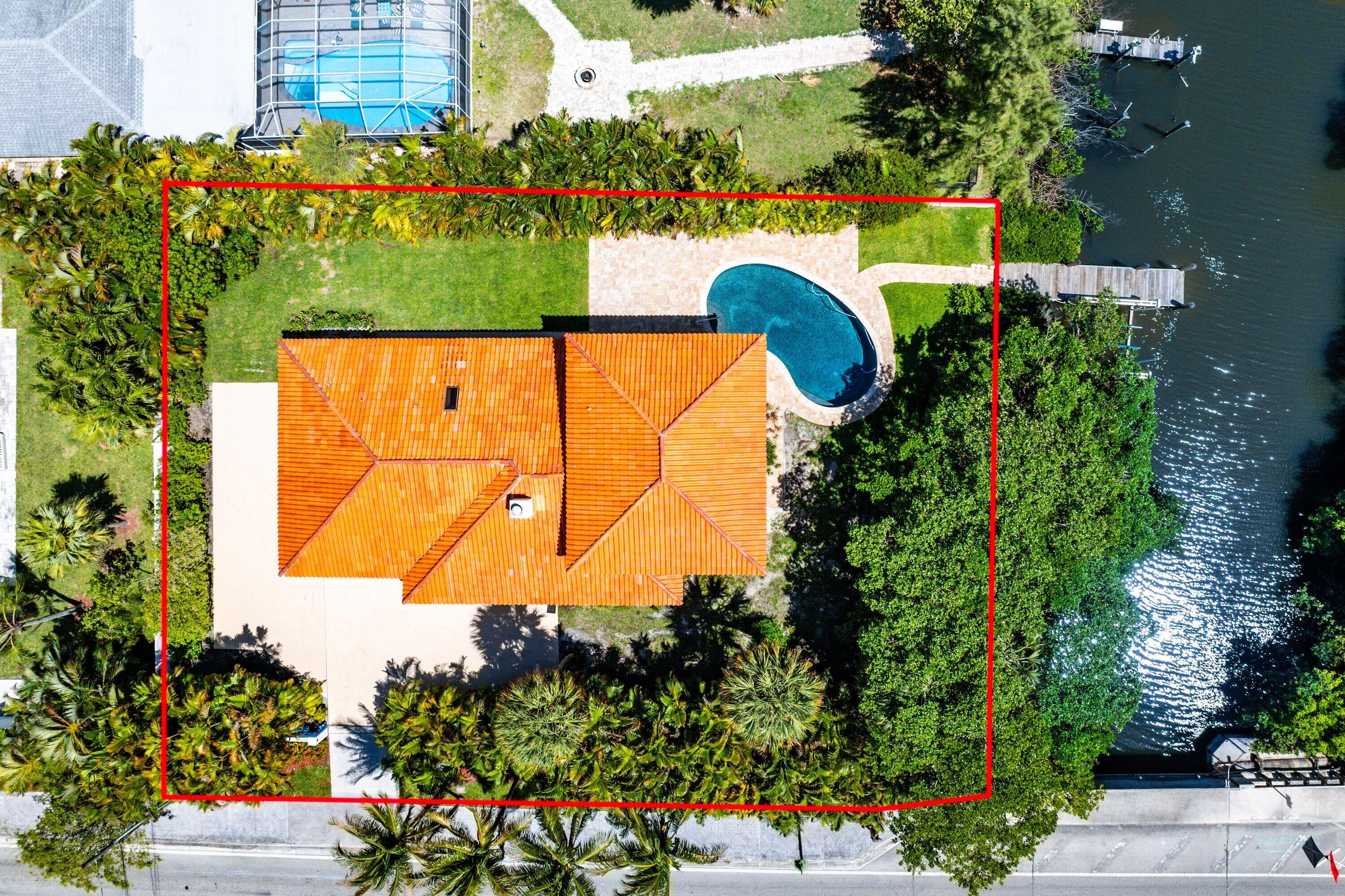 Welcome to one of the best waterfront values in Palm Beach County steps to the beach. Located on the sought-after barrier island community of Hypoluxo Island, this waterfront home offers a rare opportunity to enjoy the South Florida coastal lifestyle at an exceptional price point. Just steps from the beach and overlooking the protected waters of the Lantana Nature Preserve, this is currently the only waterfront single-family home available on a barrier island in Palm Beach County for under $3 million. Recently updated and move-in ready, the home features a beautifully renovated kitchen, updated finishes, soaring vaulted ceilings, marble flooring, and bright open living spaces designed for relaxed coastal living. The spacious primary suite enjoys tranquil water views, while the open floor  plan seamlessly connects indoor and outdoor entertaining areas.  Outdoor living is where this home truly shines. Relax beside the saltwater pool, enjoy the waterfront setting, or step onto your private dock with a 10,000-pound boat lift and easy access to the Intracoastal Waterway and Atlantic Ocean. Whether you're heading out by boat, taking a short walk to the beach, or enjoying dinner at one of the area's nearby waterfront restaurants, the lifestyle here is effortless.  This gated island retreat captures everything buyers love about South Florida living—waterfront views, beach access, boating, privacy, and exceptional value. Whether you're searching for a full-time residence, seasonal getaway, or waterfront investment, opportunities like this are increasingly hard to find.  Come discover why so many buyers are finding their way to Hypoluxo Island—one of South Florida's best-kept coastal secrets and home to some of the best waterfront values remaining in Palm Beach County.