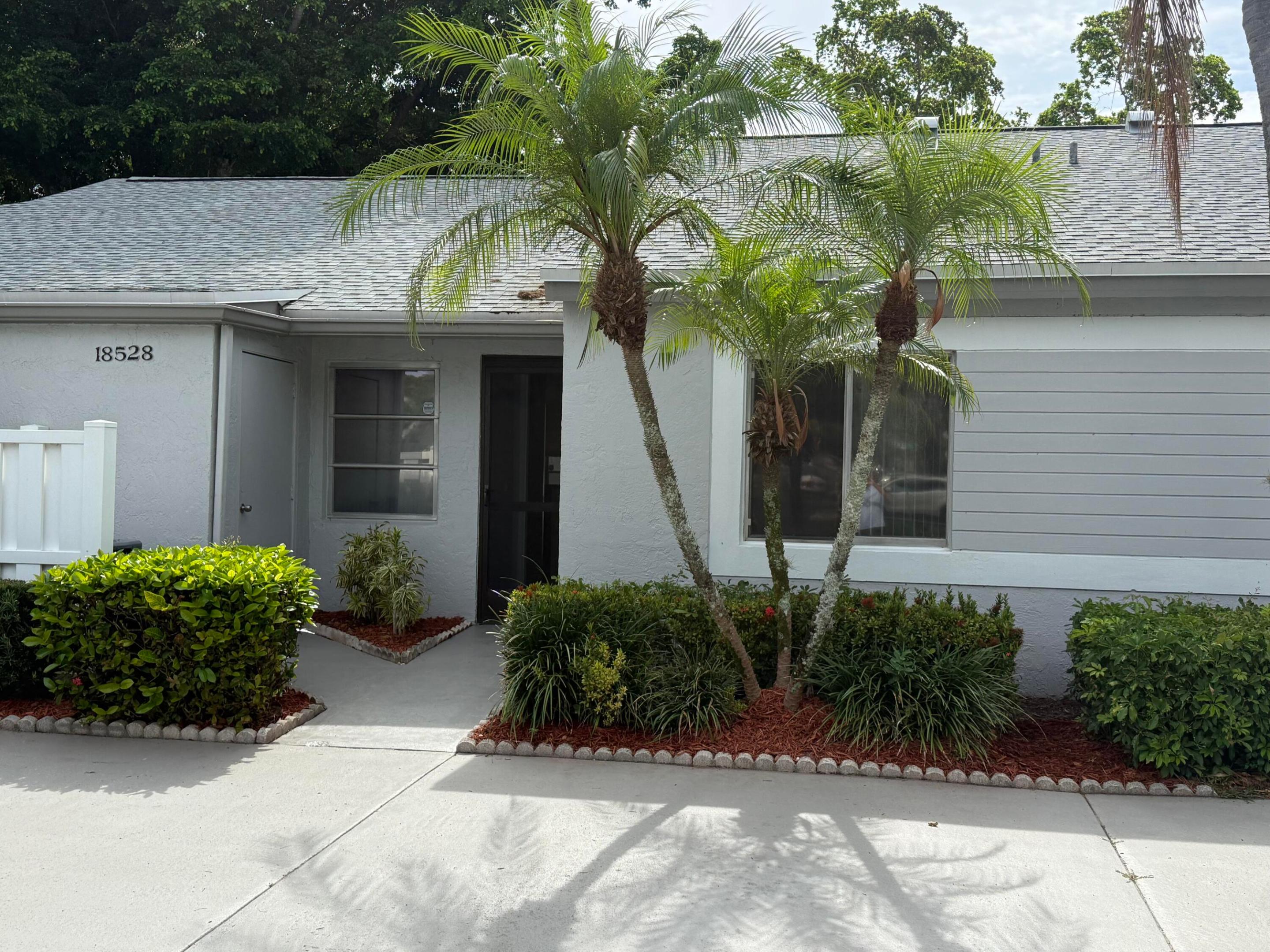 MOVE IN AND START ENJOYING THE GORGEOUS WATER VIEWS.  COOKING AND ENTERTAINING FROM THE OPEN AND UPDATED KITCHEN WITH AN EXPANSIVE COUNTER FOR SEATING & SERVING WILL BE A PLEASURE.   BOTH BATHROOMS HAVE BEEN UPDATED WITH NEWER VANITIES. THE HOME BOASTS PLENTY OF CLOSET AND STORAGE SPACE.  ENJOY EVENINGS OUTDOORS IN THE LARGE COVERED SCREENED PATIO, WHILE GAZING AT THE WILDLIFE AROUND THE LAKE.  NEWER A/C AND A NEW ROOF IN 2024.  2 PARKING SPACES RIGHT IN FRONT OF YOUR DOOR.  SITUATED IN A PARK-LIKE, 55+ COMMUNITY, COMPLETE WITH GATED ENTRANCES, TENNIS, PICKLEBALL, SWIMMING POOLS AND PLENTY OF WALKING TRAILS.  RUN DON'T WALK BEFORE IT'S GONE!