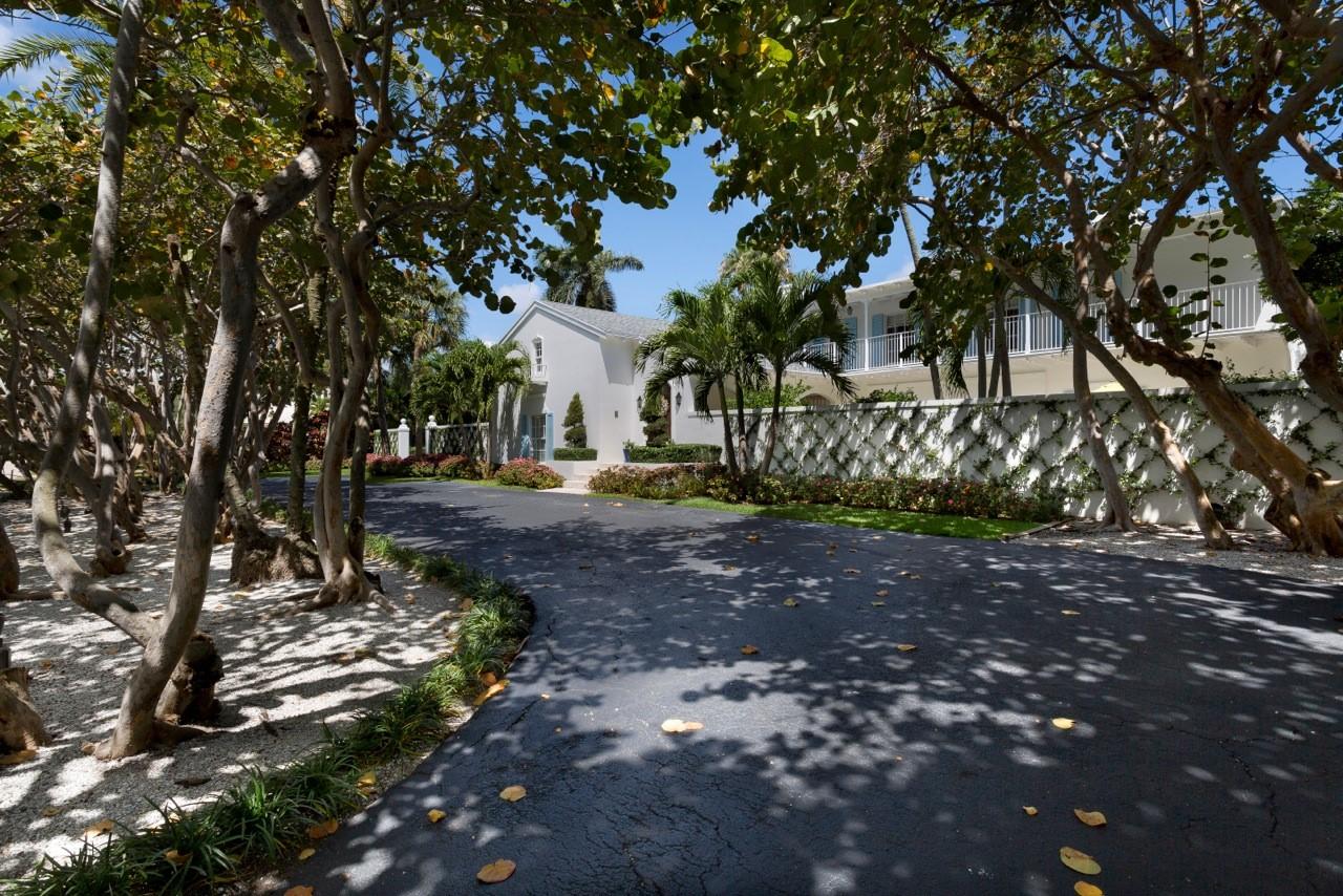 A shady tree-canopied drive to a large, walled garden courtyard with fountain creates a captivating arrival to this recently renovated Bermuda-inspired estate which fronts 150± feet on a wide, deep waterway and sits across from the Gulf Stream Golf Club.  Beautifully reimagined, this classic residence opens to outdoor spaces on both sides of each level, taking advantage of the substantial estate grounds embraced in lush greenery.  By manicured lawns on the water side, the outdoor living/dining areas of the long lanai overlook the inviting pool terrace served by a summer kitchen pavilion. The information herein is deemed reliable and subject to errors, omissions or changes without notice. The new dock has a 20,000Â±-pound boat lift.  A walled parking court is by the two-bay garage. 

DISCLAIMER: The written and verbal information provided including but not limited to prices, measurements, square footages, lot sizes, calculations and statistics have been obtained and conveyed from third parties such as the applicable Multiple Listing Service, public records as well as other sources. All information including that produced by the Sellers or Listing Company are subject to errors, omissions or changes without notice and should be independently verified by any prospect for the purchase of a Property.  The Sellers and Listing Company expressly disclaim any warranty or representation regarding all information.  Prospective purchasers' use of this or any written and verbal information is acknowledgement of this disclaimer and that Prospects shall perform their own due diligence.  Prospective purchasers shall not rely on any written or verbal information provided when entering into a contract for sale and purchase.  Some affiliations may not be applicable to certain geographic areas. If your property is currently listed, please do not consider this a solicitation.   In the event a Buyer defaults, no commission will be paid to either Broker on the Deposits retained by the Seller. "No Commissions Paid until Title Passes."    Buyer pays title insurance, Florida documentary stamps, and all other closing costs for New Construction and land use. Copyright 2016 Listing Company.  All Rights Reserved.