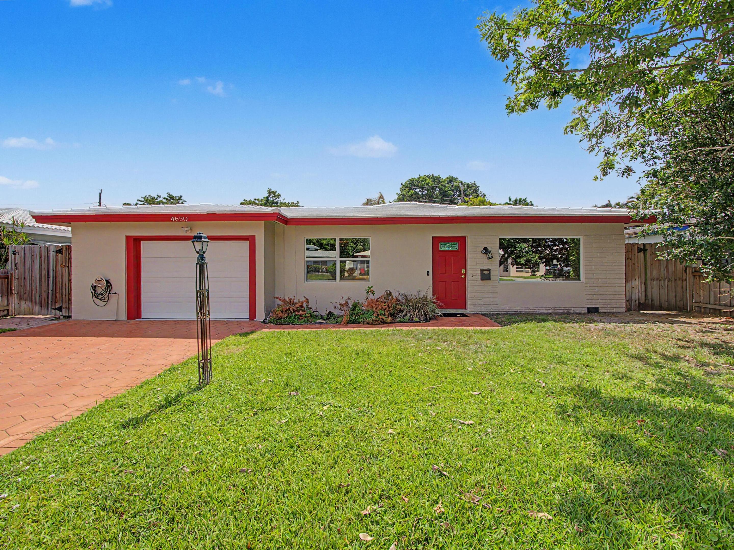Welcome to this charming 3-bedroom, 2-bathroom single-family home offering 1,584 square feet of living space in a highly desirable East Broward location with **NO HOA**. Ideally situated just 10-15 minutes from Fort Lauderdale Beach, this home also provides easy access to I-95, US-1, the Florida Turnpike, shopping, dining, and everyday conveniences.  Inside, you'll find a spacious Old Florida-style layout featuring a welcoming living room, dedicated dining area, and an expansive Florida room with its own private entrance and direct access to the garage, perfect for entertaining, a home office, or additional living space. The interior was just freshly painted, creating a bright and inviting feel throughout. The exterior has also just been pressure washed and freshly painted, offering excellent curb appeal with a paver driveway and spacious front yard. Enjoy the screened patio with brand-new screens installed and floor painted, ideal for relaxing year-round.  The backyard is fully fenced in, providing privacy and plenty of room for pets, play, or gardening. Relax around the backyard fire pit on cozy evenings with family and friends. A storage shed offers additional space for tools and outdoor equipment  Additional features include hurricane impact windows and doors (2008), a 2019 A/C, and a 2014 roof for added peace of mind. The freshly painted one-car garage offers built-in shelving and cabinetry, a laundry area, and extra space for a workshop or additional storage.  Whether you're a first-time homebuyer, seasonal resident, or investor, this home offers potential, convenience, and an unbeatable location.   Schedule your showing today!