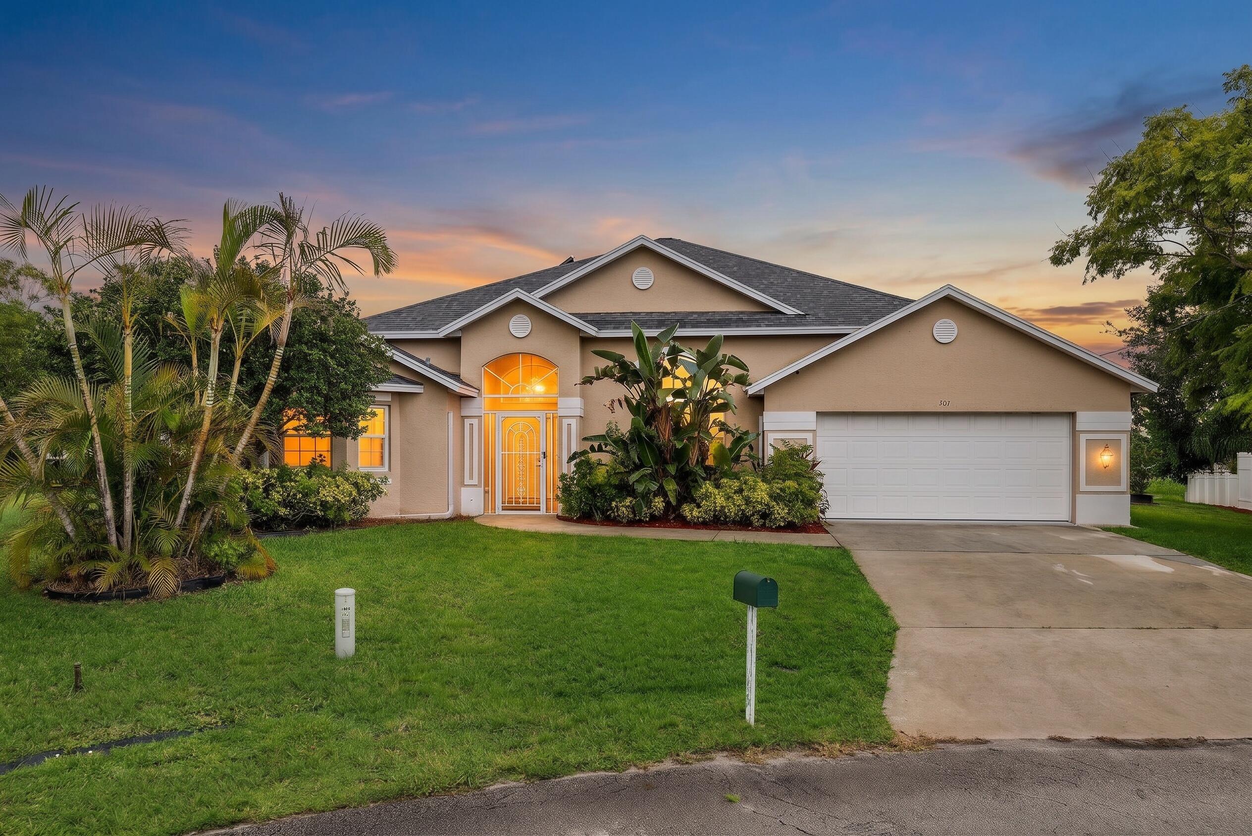 Located on a quiet cul-de-sac and set on an oversized 0.33-acre lot with beautiful canal views, this private pool home offers the perfect combination of space, comfort, and convenience. With no HOA and just minutes from Gatlin Boulevard, Tradition, shopping, dining, and major commuter routes, you'll enjoy both privacy and an ideal location.  The home features 3 bedrooms, 2 full bathrooms, a convenient cabana half bath with direct access from the pool area, and a huge flex room that can easily serve as a 4th bedroom, office, gym, or playroom. A split floor plan, soaring 14-foot ceilings, tray ceilings in the primary suite, vaulted ceilings in one guest bedroom, and a formal dining room create a spacious and functional layout. Major updates include a new roof, HVAC system, and tankless water heater, all completed in 2022. Most windows are impact-rated, while accordion shutters protect the screened lanai. The kitchen also features newer appliances, including the refrigerator, cooktop, and dishwasher.  Relax in your private backyard featuring a solar-heated pool, scenic canal views, an oversized yard, a hurricane-rated storage shed, and a charming treehouse. Competitively priced, this home offers exceptional value with major updates, generous living space, and no HOA.