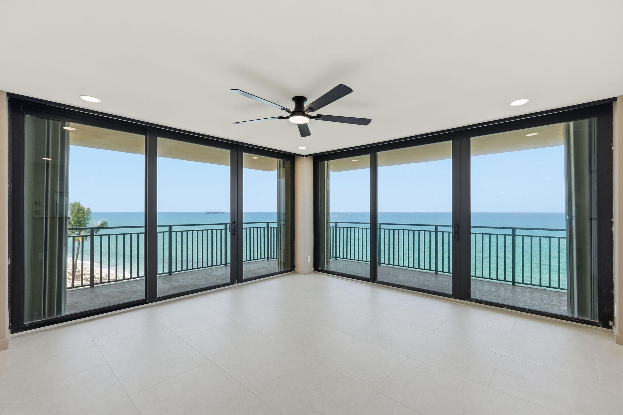 Wake up to breathtaking Atlantic Ocean sunrises and enjoy panoramic water views from every room in this beautifully renovated oceanfront residence at Seagrape Condominium. Perfectly positioned on the desirable northeast corner, this exceptional 2-bedroom, 2-bath condominium offers approximately 1,424 square feet of sophisticated coastal living. Floor-to-ceiling glass and multiple balconies showcase endless ocean vistas and intracoastal views while capturing refreshing sea breezes throughout the home. No detail has been overlooked in the comprehensive renovation. The residence features a designer kitchen with premium finishes, beautifully updated bathrooms, modern flooring, impact glass doors and windows, and a bright open-concept floor plan designed for effortless living and entertaining.  The spacious primary suite offers a private ocean-view balcony, generous closet space, and a luxurious spa-inspired bath. A split-bedroom layout provides privacy for family and guests, while every room enjoys direct access to spectacular water views.  Residents enjoy private beach access, resort-style amenities, a renovated lobby and common areas, heated pool and spa, fitness center, tennis and pickleball courts, clubhouse, storage, and assigned parking. Located on the quiet north end of Singer Island, this premier oceanfront community is minutes from shopping, dining, boating, and outdoor recreation. Experience the ultimate South Florida lifestyle where luxury, privacy, and unobstructed ocean views come together in one extraordinary residence.
