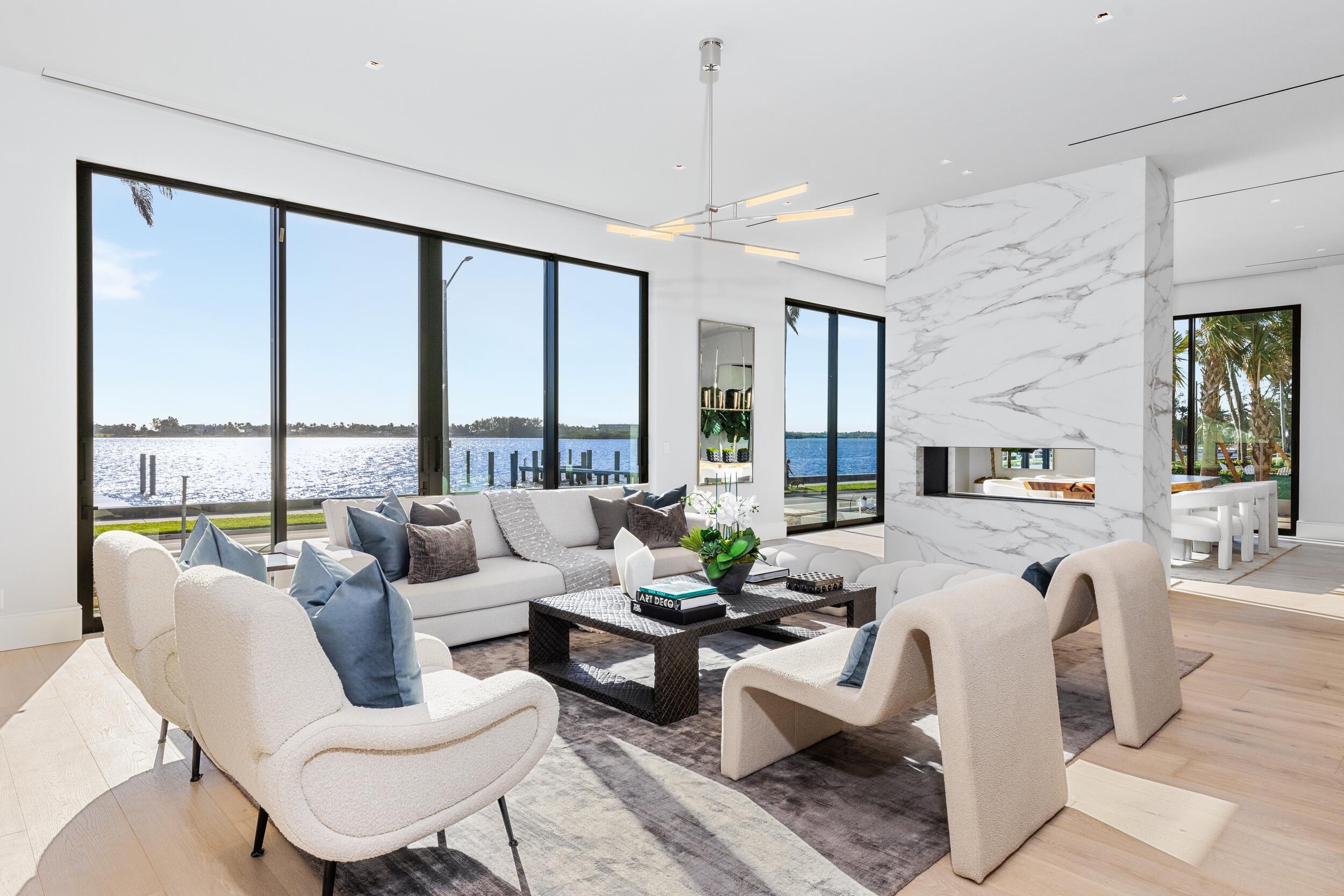 Spectacular brand new waterfront on Flagler Drive meets modern luxury. This trophy property was just completed and no details overlooked. Designed to offer unobstructed water views from main living areas and bedrooms. The resort-style residence offers indoor and outdoor entertaining areas; 8 bedrooms, 10 full and 1 half bath, and expansive terraces. The tropical outdoor oasis features a pool and spa, summer kitchen, covered patio and professional landscaping. Additional amenities include boat dock, elevator, whole house generator, exercise room, first floor den/guest bedroom with full bath, 3-car garage, top-of-the-line finishes throughout and many more.