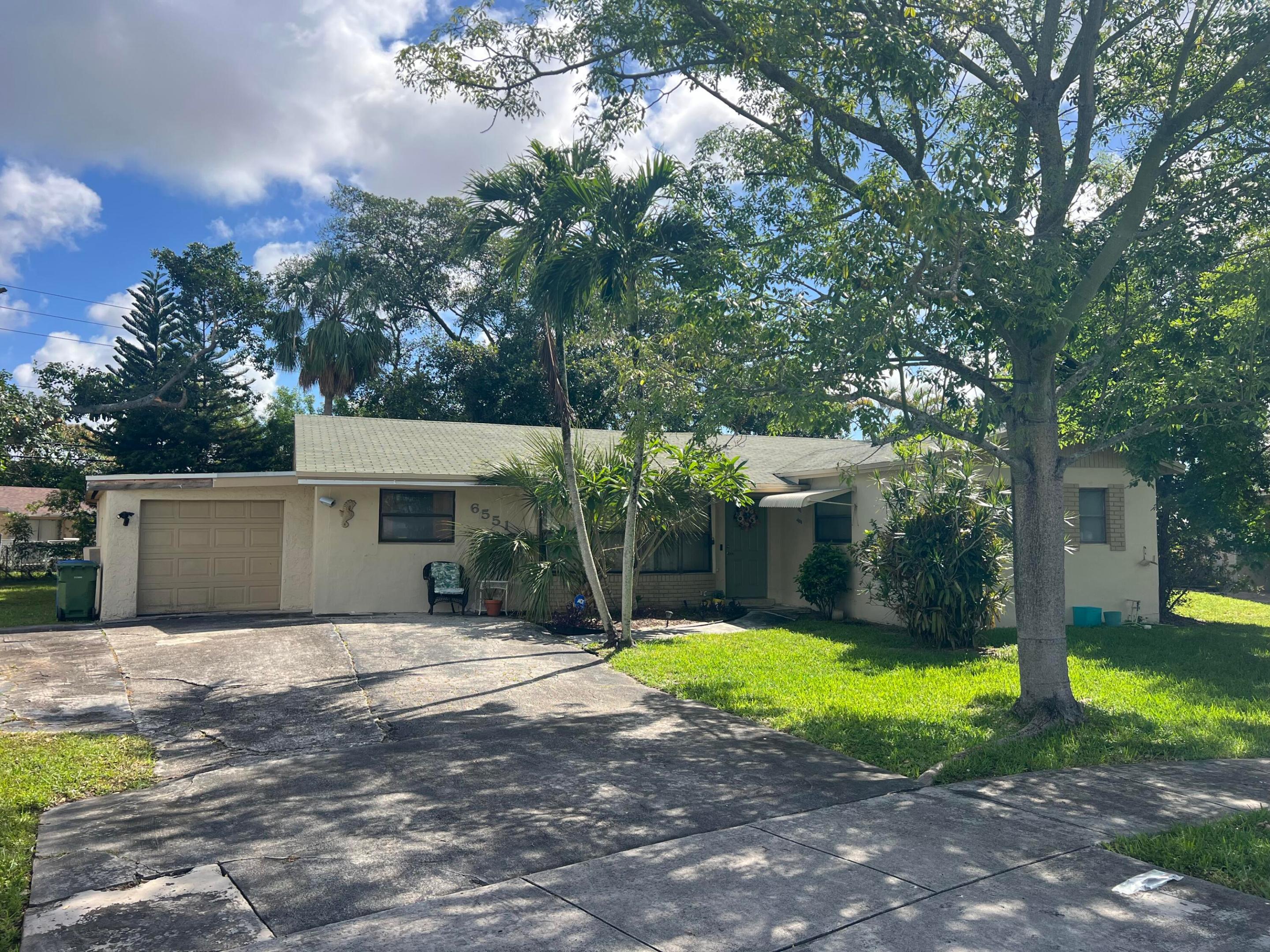 Rare opportunity to transform this spacious home situated on an oversized 13,179 sq. ft. lot with NO HOA. This fixer-upper offers incredible potential with 4 bedrooms, a Florida room, and an additional bonus room that can easily be a 5th bedroom by converting built in's into a closet . Flexible floor plan provides plenty of space on the interior. The expansive lot offers room for a pool, outdoor entertaining area, boat storage, or future enhancements. Conveniently located in an established Margate neighborhood close to schools, parks, shopping, dining, and major roadways. Own one of one of the larger lots in the area, bring your vision and make it your own.