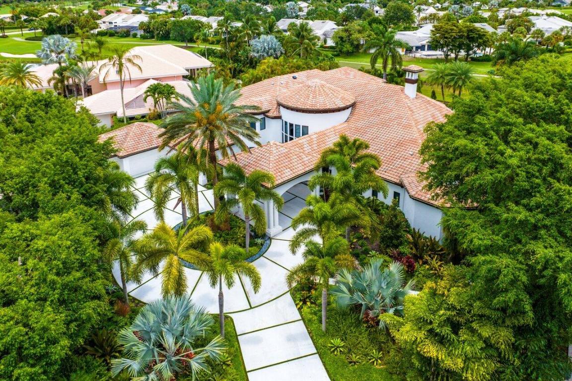 WELCOME TO THE ISLAND, THE CROWN JEWEL OF BOCA WEST COUNTRY CLUB! EXPERIENCE THE NATION'S #1 PRIVATE RESIDENTIAL COUNTRY CLUB LIFESTYLE. THIS EXCLUSIVE, GATED ENCLAVE OFFERS UNPARALLELED PRIVACY WITH ONLY 12 CUSTOM HOMES, EACH BOASTING BREATHTAKING LAKE AND GOLF COURSE VIEWS. OWN 7728 SQ FT OF LUXURIOUS LIVING SPACE ON A LUSHLY LANDSCAPED .66-ACRE LOT. THIS HOME EPITOMIZES SOPHISTICATION AND COMFORT. STEP THROUGH THE GRAND OVERSIZED GLASS PIVOT DOOR INTO A STUNNING FOYER. THIS HOME HAS 5 GARAGES, ONE FOR GOLF CART. EXPERIENCE THE PINNACLE OF LUXURY LIVING IN THIS REMARKABLE HOME WHERE CHARACTER, STYLE, AND QUALITY BLEND SEAMLESSLY. COME SEE FOR YOURSELF. HERE'S YOUR OPPORTUNITY TO OWN A PIECE OF PARADISE ON ''THE ISLAND''