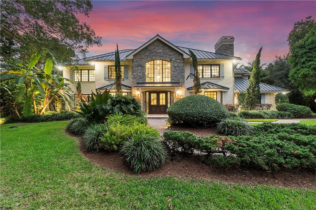 Spectacular hidden custom Estate with 3 structures on 2.6 acres, Main house has been newly rebuilt from the studs to a 2 story masterpiece  & attic playhouse fit for Royalty, Marble & wood design flooring & hand carpentered millwork surrounding dining & living, Chefs kitchen w/ natural quartz countertops & top of the line appliances, cocktail bar, Breathtaking foyer with hand designed stairway leading to the 2nd & 3rd floor, Separate 2/2 guest house with full kitchen & living room, 2 car garage & carport, main house & guest house divided by 150+feet smart LED heated pool with rock Spa & separate Cabana/pool house with 2 bed areas & vanity, Landscaped surrounding the property, completely hidden for complete privacy & securely fenced & walled & guard dogs, Strictly by appointment only, All 3 structures have been rebuilt in 2018.These 3 structures were designed and built for privacy so that the homes cannot be seen from the roadside and is fully fenced for guard dogs to roam the property,2 privacy iron gates with 1 electronic gate.Main house is 7823 sq feet under A/C as measured by appraiserGuest house is 2021 Sq feet under A/C  as measured by appraiserCabana/Poolhouse is 260 sq feet under A/C as measured by appraiser, Winding enchanting pathways throughout the property exterior with lush landscaping over 30 feet high for privacy,The 150+ fiber optic heated pool has color interchanging intervals of purple, orange, deep blue,lime green, red and pink and more colors to choose from with a lazy river surrounding & below the 12 person hot tub, Driveway can hold 25-30 cars and there is a larger space on other side of property for larger vehicles like RV'sThe millwork on the walls, ceilings, moldings & cabinetry was installed & hand carved by a local carpenter who does all his work by hand, Only 1 road for entry into the Ranches and this road is monitored for security 24/7,