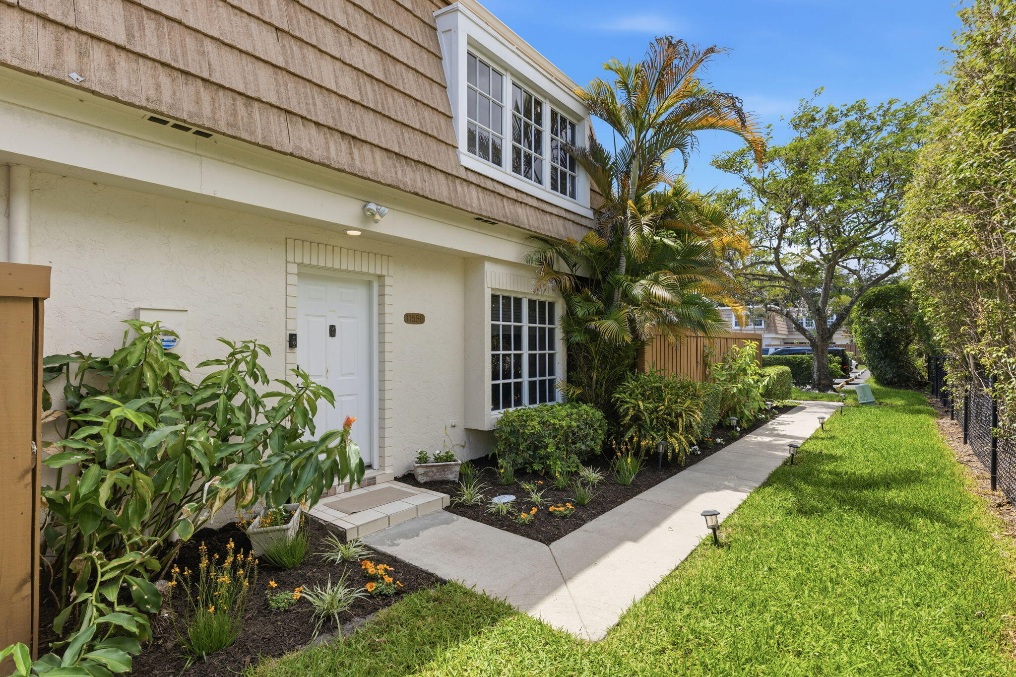 Welcome to this charming three-bedroom, two-and-a-half-bathroom townhouse in the well established Winchester Court community.  Spanning 1,562 square feet over two stories, this home features a thoughtfully designed layout that maximizes space and creates a practical flow for any lifestyle. The main level features an open-concept kitchen, dining, and living area, complete with a versatile bonus room currently used as a gym. Upstairs, the bedrooms offer a private retreat. A fantastic fenced-in patio provides a seamless transition to the outdoors, perfect for relaxing or entertaining guests. Seller is offering a 1Year 2:10 Supreme buyer's home warranty! This home offers an fantastic opportunity to experience the best of Palm Beach Gardens living, request a private showing appointment today!