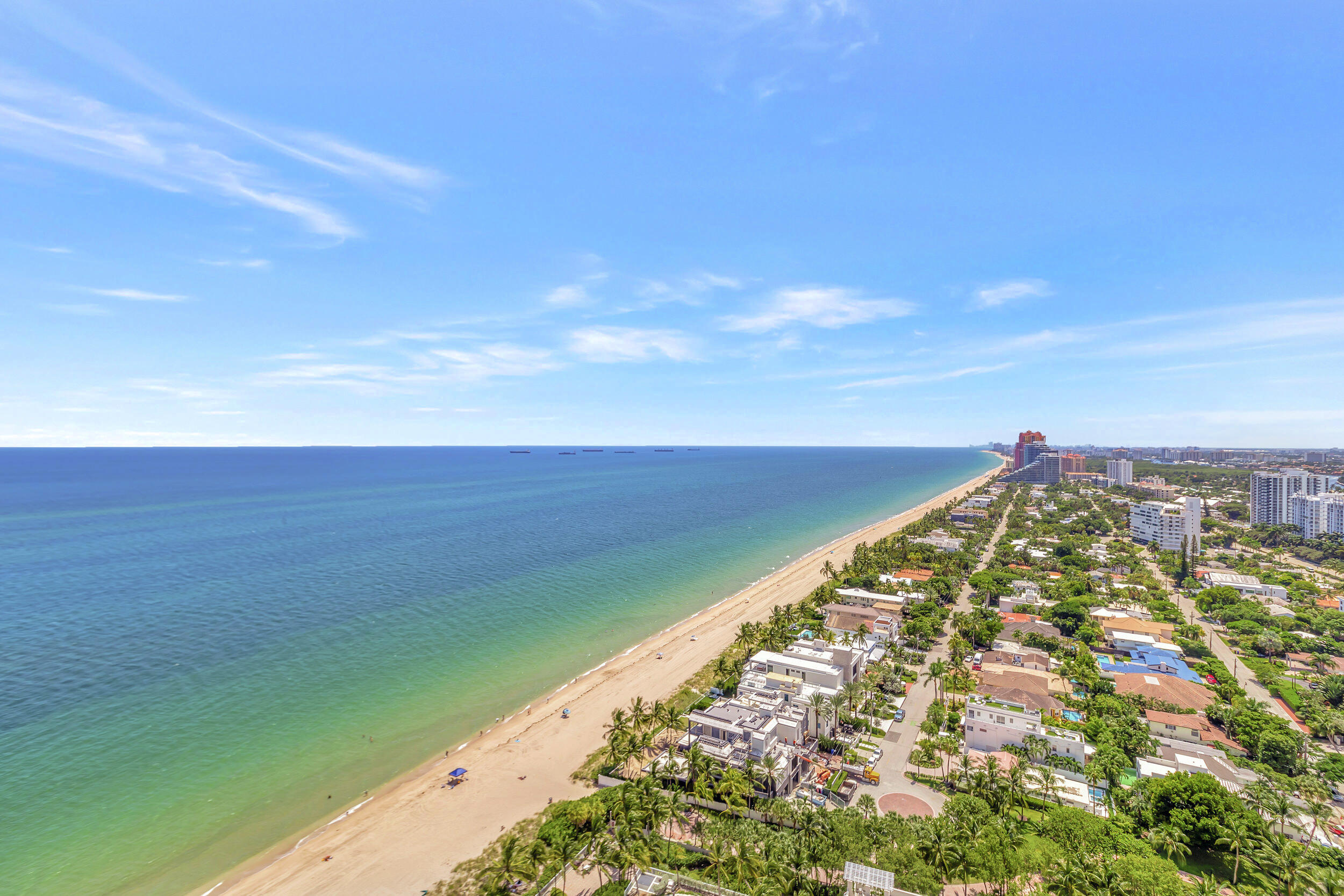 Direct oceanfront views at L'Hermitage! Elegantly renovated and move in ready. This penthouse features 4 Balconies with expansive views of ocean, city and intracoastal. There are 3 bedrooms, 4.5 bathrooms and an office/den. The primary bedroom has 2 private bathrooms, large walk-in closet with custom cabinetry and shelving and breathtaking views of the ocean. Each guest bedroom features it's own private ensuite and with water views.  The kitchen has been designed with the most high end appliances, Blue Bahia Marble island with a waterfall feature, high gloss white cabinets, with white quartz counter, giving that sleek white on white modern style. Large open living room and dining areas w/views from every angle. Travertine marble throughout, Lutron lighting system, elec electronic window shades, complete impact windows, 2 deeded garage spaces and a private elevator to the penthouse. L'Hermitage is situated on 10 acres of coastal property, 24 hour gated security, 2 large heated pools, outdoor restaurant, Har Tru tennis courts, gym and saunas. This Condominium is situated on the Galt Ocean Mile near restaurants and shopping. Luxury living at its finest!