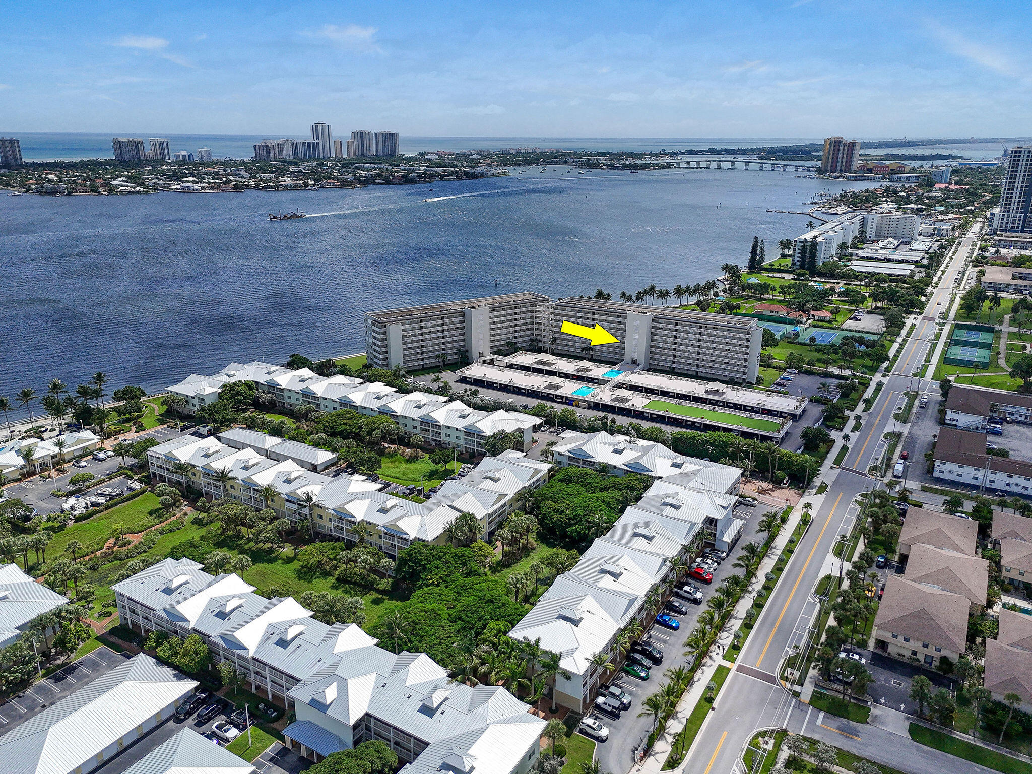 Wake up to sparkling Intracoastal views and gentle coastal breezes from this well-positioned 2BR/2BA split floor plan in the gated community of Lake Harbour Towers East. Enjoy a private balcony overlooking Intracoastal and Kelsey Park's lush green space and waterfront pathways, just moments from the Lake Park Marina and the exciting waterfront redevelopment at Nautilus 220 with new dining options to all!   This residence offers a functional layout with in-unit washer/dryer, tankless water heater, hurricane shutters, and plantation-style window treatments. Priced to allow immediate enjoyment with the opportunity to update and personalize over time while capturing exceptional views in a sought-after waterfront setting. At least one buyer must be 55+ in this vibrant waterfront community. Lake Harbour Towers East is a waterfront community offering a true Florida lifestyle at an exceptional value. This well-maintained community features two buildings, each with its own distinct charm. Residents enjoy approximately 350' of Intracoastal frontage, providing sweeping water views and a scenic seawall promenade overlooking Singer Island. The "Park Building" includes an inviting lobby, mail room, and a spacious social room with kitchen, big screen TV, and plenty of room to host gatherings, events, and social activities. All four elevators (two in each building) have just completed a full replacement (2025-2026), enhancing both reliability and convenience with seamless access between the buildings.  Residents enjoy peaceful moments along the waterfront path with benches, a fishing station, and open green space, as well as a variety of amenities designed to enhance their waterfront lifestyle. Expansive deck areas above the covered parking feature two swimming pools, including one that is heated for year-round enjoyment. Shaded lounging areas provide a relaxing retreat, while BBQ areas, putting green, pool table, and shuffleboard courts add opportunities for recreation and socializing in this vibrant community atmosphere. Reserve Study & Milestone Inspections completed. Stage two not required, nor Assessments!  Kelsey Park, adjacent to LHTE, has beach access, multiple tennis courts, pickleball (west courts only), scenic walking trails, and community events, while Lake Park Harbor Marina is just two blocks south, offering easy access for boaters and other favorite water activities. There's no shortage of activities to enjoy. This ideal location is just minutes away from beautiful beaches, shopping, dining, golf courses, marinas, around the Palm Beaches, as well as the Palm Beach International Airport.  Great location and exceptional value in Lake Park, FL — affectionately known as the "Jewel of the Palm Beaches."  Upgrades and Features: This unit includes 1 parking space under carport + 1 open parking / 1 exterior storage closet  / Tankless WH - 2021 / Refrigerator & Dishwasher 2020 / Carrier AC Handler & Condenser 2019 / W/D 2016 / GE Electrical Panel - 2003  / Engineered wood flooring in main living areas and front bedroom (plus spare box+) / Corian countertops / Updated white cabinets / Plantation shutters on all windows & sliders.