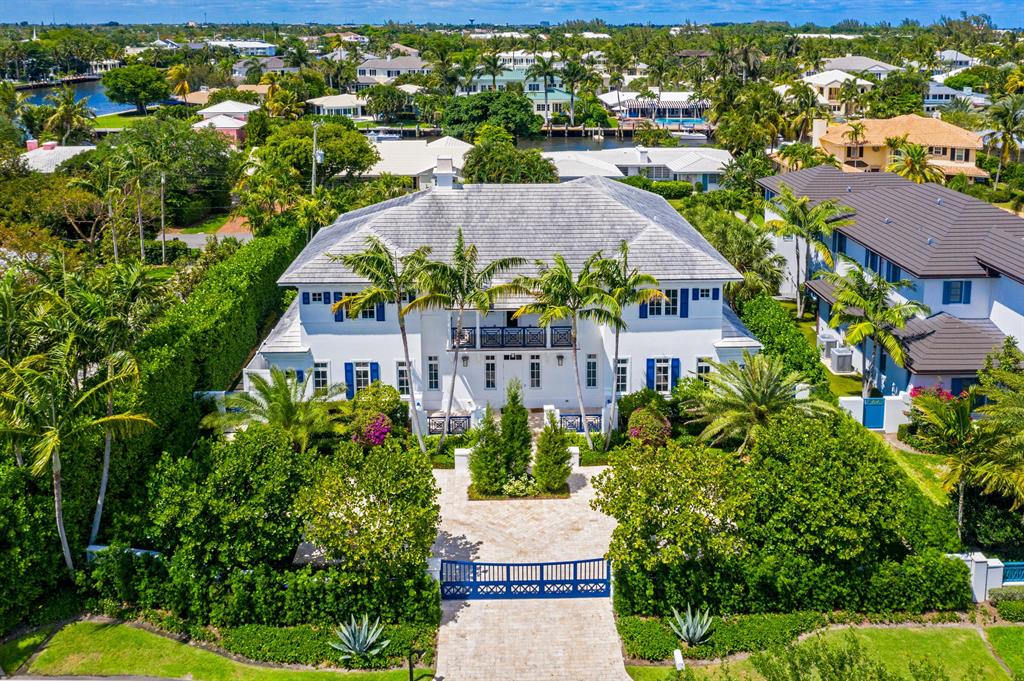 This newly built (2013) two-story all poured and block concrete Bermuda Colonial style smart home is located at 1041 Seaspray Avenue, on a quiet cul-de-sac in the most distinguished enclave only a few blocks from famed Atlantic Ave. and the pristine beaches of Delray.  Sited on a very large parcel in the north beach area with ingress and egress access from two streets, the gated residence features a large front courtyard entry and separate motor court in the rear with a three-car garage. This elegant home, is comprised of 7,716 total sqft, featuring 6BB/5.2BA. The social hub of the home is a newly installed kitchen with an oversized island, lots of counter space all finished with Neolith Estatuario slabs, top of the line appliances, 6 burner gas stove, and a wall of windows that bathe the entire space with natural light. Adjacent to the kitchen are two large butler's kitchens, one with a full-sized refrigerator and dishwasher.  An open living area reveals soaring, beamed ceilings and floor to ceiling glass doors, which open and pocket to juxtapose the inside and outside space creating a seamless flow to the loggia.  Your favorite sports and entertainment options are provided by a state-of-the-art custom screening room separate but adjacent to the kitchen complete with 7.1 sound, full complement of high-end equipment and acoustic fabric walls, isolating the theater from other rooms.  Upstairs accessed via staircase or elevator, the luxurious master suite has a beamed ceiling and is complete with a sumptuous bath and an adjacent cozy sitting room/office.Five additional bedrooms similarly styled are ready for family or guests to enjoy. A special feature of this home is the fully separate guest suite on the first floor with its own outside entrance, security system, breakfast bar with refrigerator and microwave.  To complete this lovely home, there is a covered first-floor loggia designed with New England style Douglas fir custom screens, an upper-level wrap-around veranda, fire pit, a new (2018) pool, spa, and brand new 'swim against" professional training machine plus a fully fenced dog run for your furry friends.  Mature landscaping surrounds the entire property and easy to care for top of the line Monsanto Agri-Turf guarantees a green lawn all year round providing ultimate privacy. Quite simply the home expresses pure perfection.