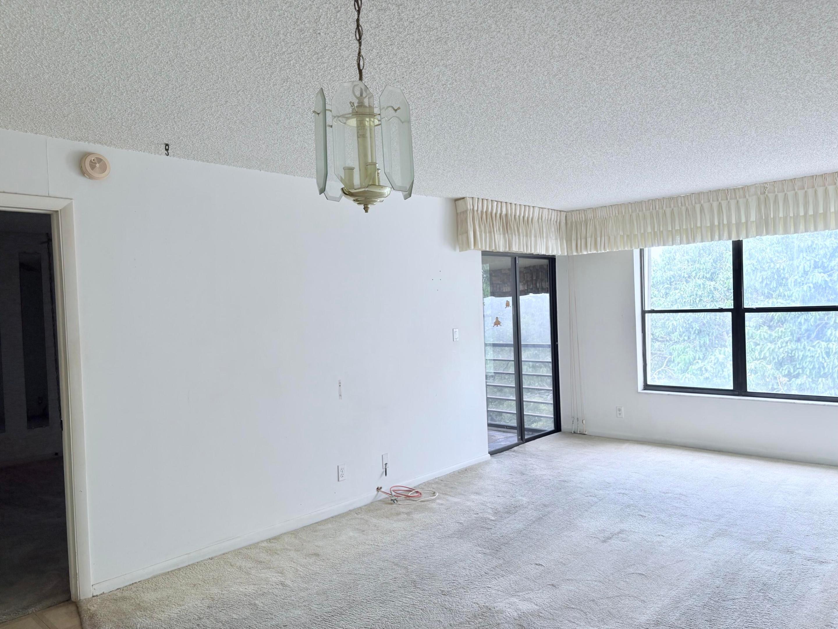 Welcome to Cypress Bend! Spacious 1 bedroom, 1full bathroom and 1/2 bathroom condo with lots of storage with a huge walk in closet in the master bedroom. Make this into your own special home at a selling price that you can't resist. Concrete restoration in full progress and the 35K assessment will be paid by the seller at closing. Cypress Bend is a hidden gem with a serene park like setting. Bike and walking trail, fitness center, clubhouse, 5 pools, tennis and pickleball. All ages, pet friendly and close to everything; 5 miles to the beach, I95, FL TNPK, shopping, casino and restaurants. Walk to Walgreens and other shopping. Golfing across the street!