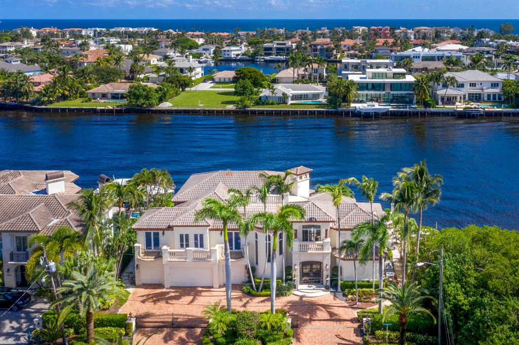 Gated Intracoastal Point Lot Estate with the most Amazing 170' of prime Intracoastal waterfrontage! Superior quality & craftsmanship throughout this Masterpiece. 6BR, 6 ½ BA, 4-car garage, elevator, fireplaces, Media Room, separate guest quarters. BEST point lot in Boca. This unique lot juts into the Intracoastal more than 60ft creating a private island feeling. Over 170ft of boat dock total; 2 customized hydraulic boat lifts accommodating up to 60ft. Your only NEIGHBOR to the south are trees, federally protected mangroves, no condos blocking views in any direction. Heated pool w/spa overflow, grill area & covered loggia. Upon entry you see a beautiful 23ft soaring CORAL fireplace in the living room w/coffered ceilings & columns throughout. 60k Pound Boat Lift; 55,000k on it
45k Brand New 2 year Generator
2018 All New Impact Windows 9mm rating'
Entire Smart Home with all new wiring
3 A/C units
Whole Kitchen 6 years new
2 new dishwashers
All new real wood floors in the bedroom
Master bath is all new
Diamond Tile Pool  Heating 
Exterior home painted approx. 2016
1,000 gallon Propane