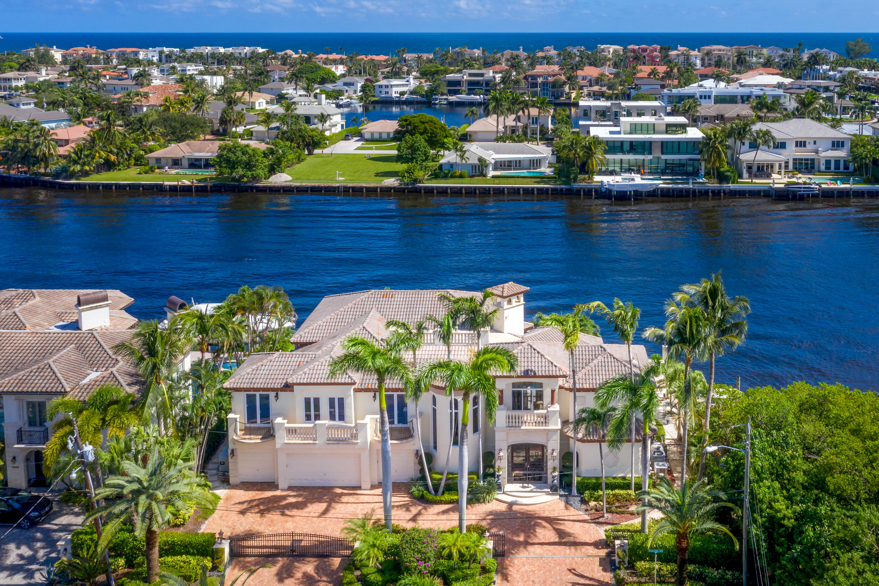 Gated Intracoastal Point Lot Estate with the most Amazing 170' of prime Intracoastal waterfrontage! Superior quality & craftsmanship throughout this Masterpiece. 6BR, 6 ½ BA, 4-car garage, elevator, fireplaces, Media Room, separate guest quarters. BEST point lot in Boca. This unique lot juts into the Intracoastal more than 60ft creating a private island feeling. Over 170ft of boat dock total; 2 customized hydraulic boat lifts accommodating up to 60ft. Your only NEIGHBOR to the south are trees, federally protected mangroves, no condos blocking views in any direction. Heated pool w/spa overflow, grill area & covered loggia. Upon entry you see a beautiful 23ft soaring CORAL fireplace in the living room w/coffered ceilings & columns throughout. 60k Pound Boat Lift; 55,000k on it
45k Brand New 2 year Generator
2018 All New Impact Windows 9mm rating'
Entire Smart Home with all new wiring
3 A/C units
Whole Kitchen 6 years new
2 new dishwashers
All new real wood floors in the bedroom
Master bath is all new
Diamond Tile Pool  Heating 
Exterior home painted approx. 2016
1,000 gallon Propane